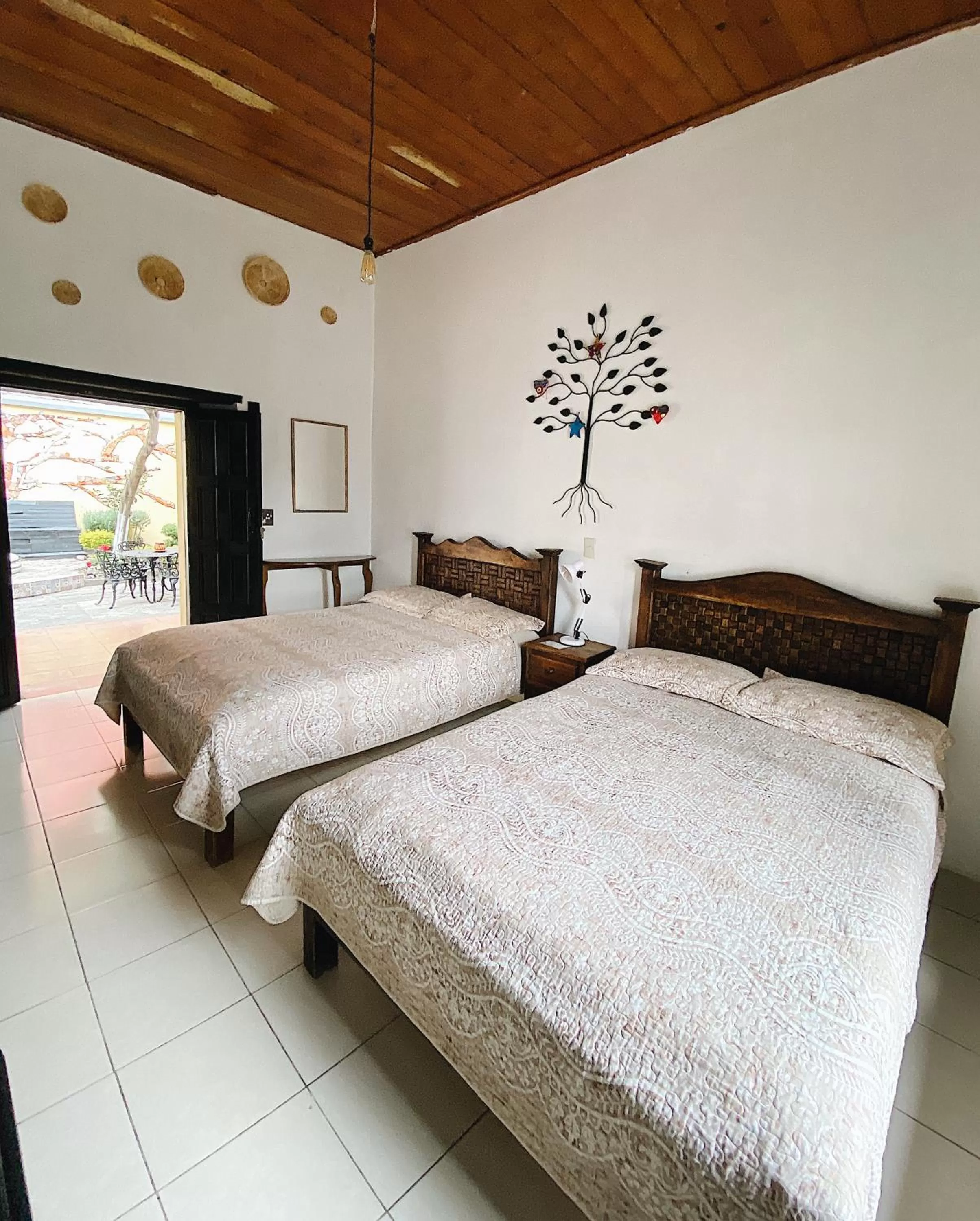 Photo of the whole room, Bed in El Naranjo Hotel Finca Urbana