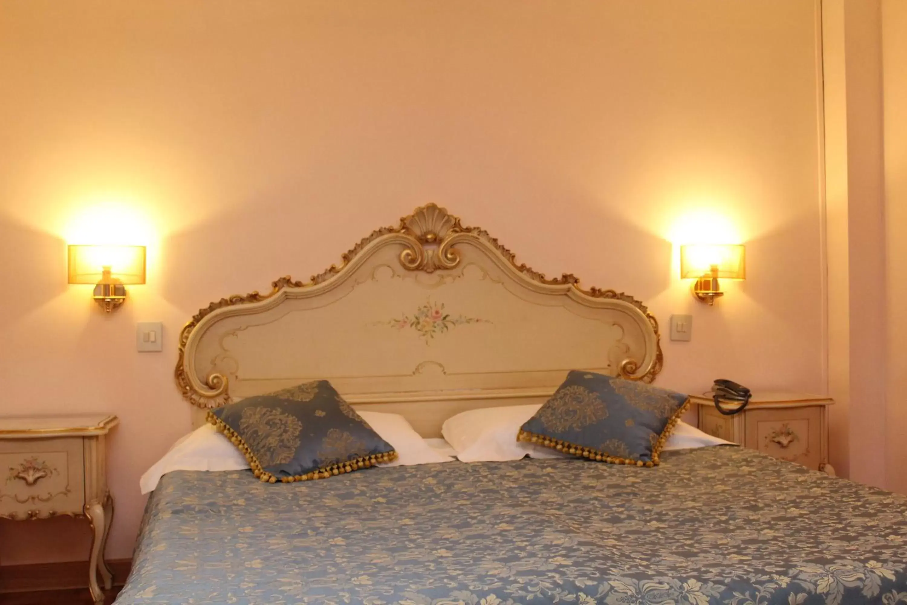 Bed in Royal San Marco Hotel