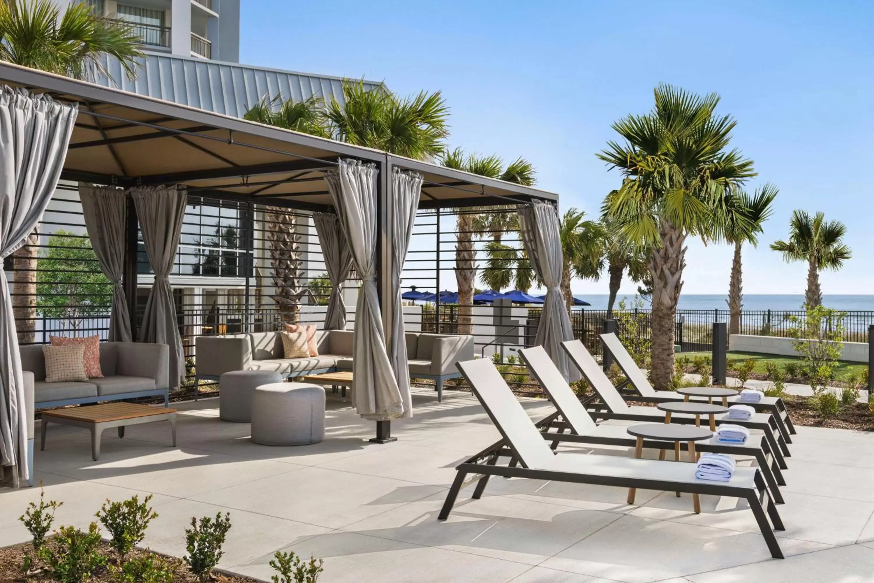 Patio, Swimming Pool in Embassy Suites by Hilton Myrtle Beach Oceanfront Resort