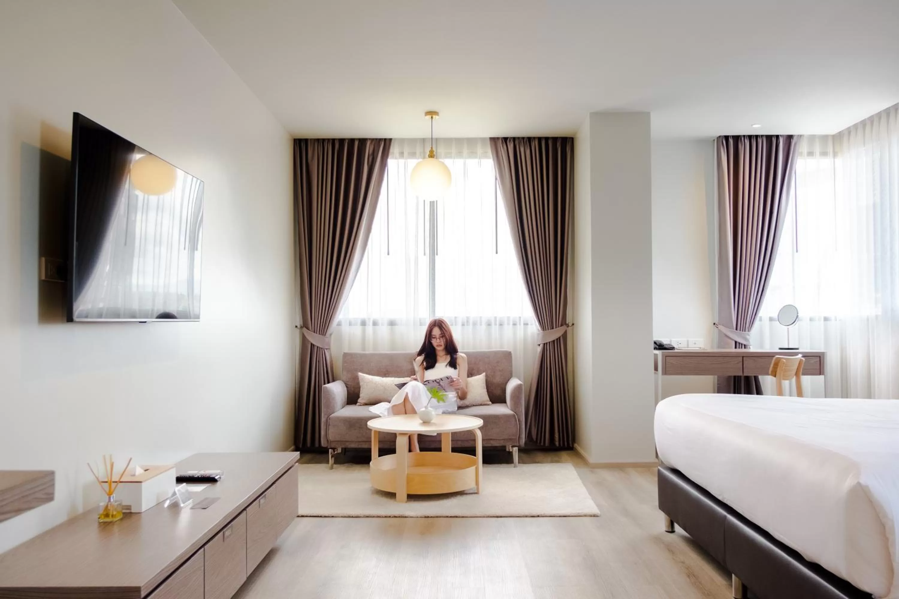 Photo of the whole room, Bed in The Rise Suites Hotel, Chiang Mai - SHA Extra Plus