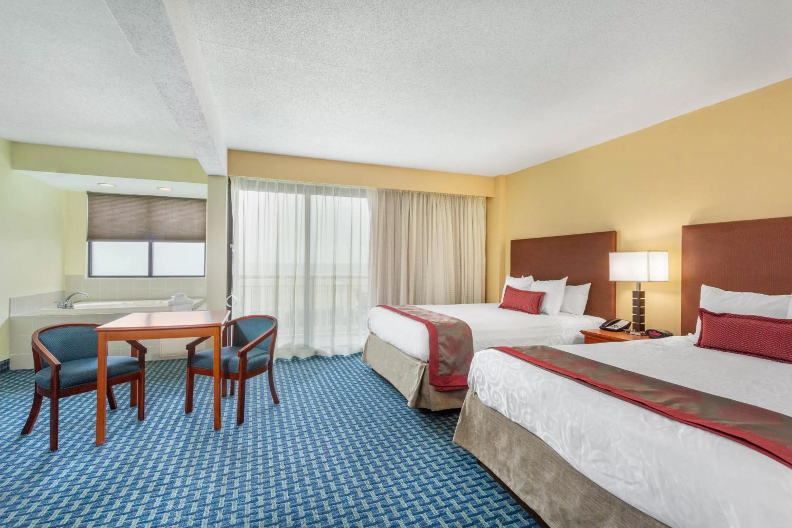 Bedroom, Bed in Ramada Plaza by Wyndham Virginia Beach Oceanfront