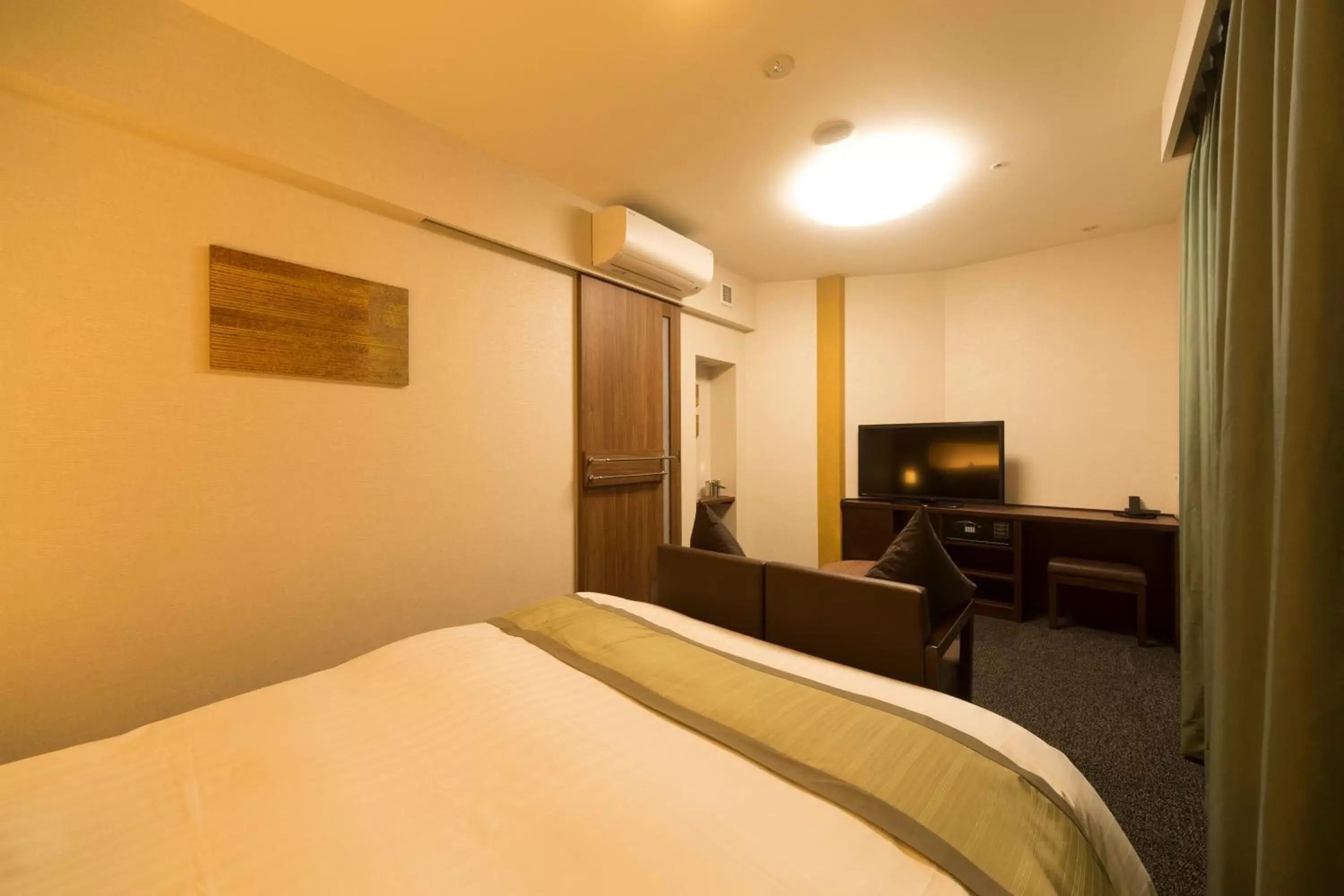 Bed in Myoujin-no-Yu Dormy Inn Premium Kanda