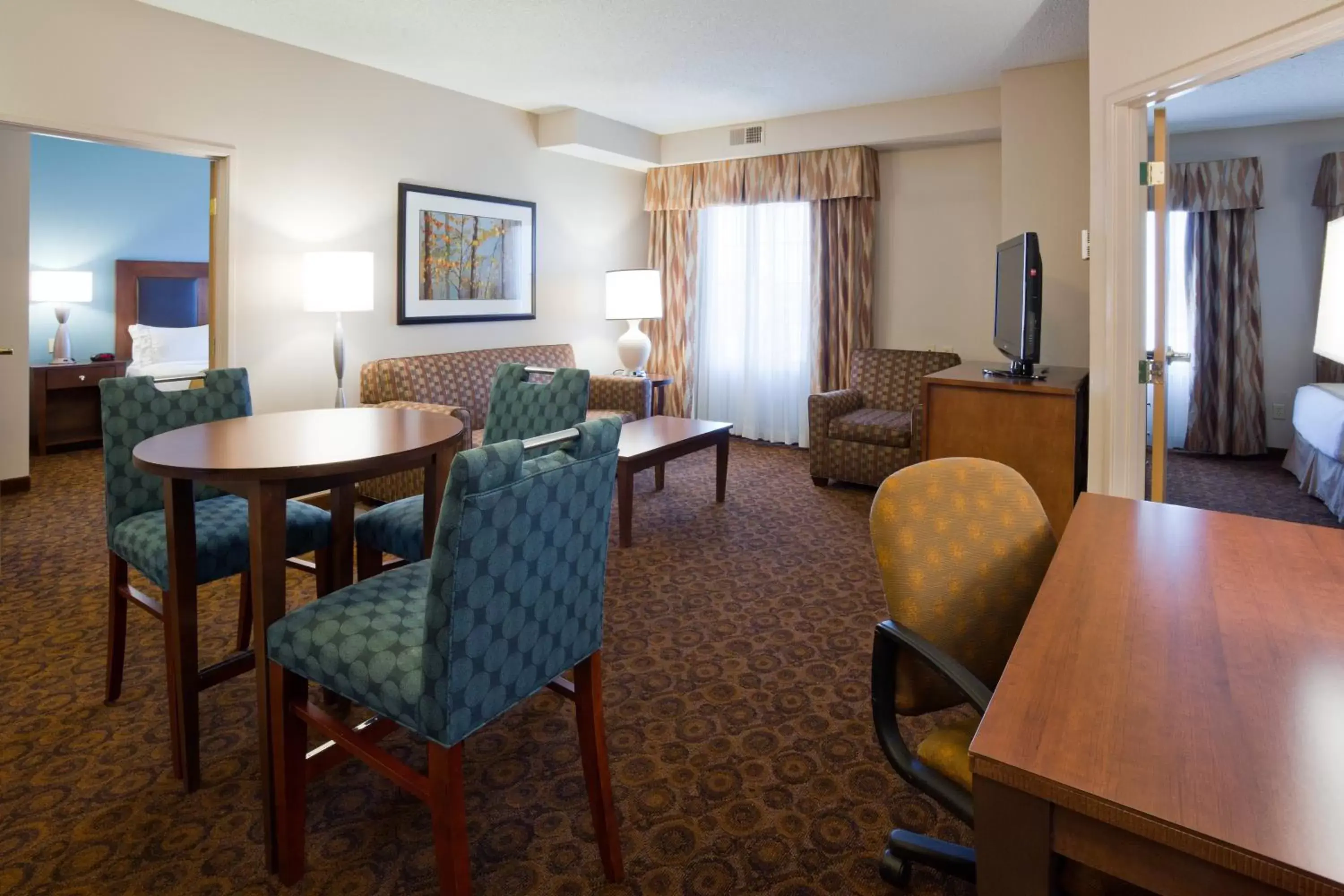 Bedroom, Dining Area in Holiday Inn Express and Suites St. Cloud, an IHG Hotel