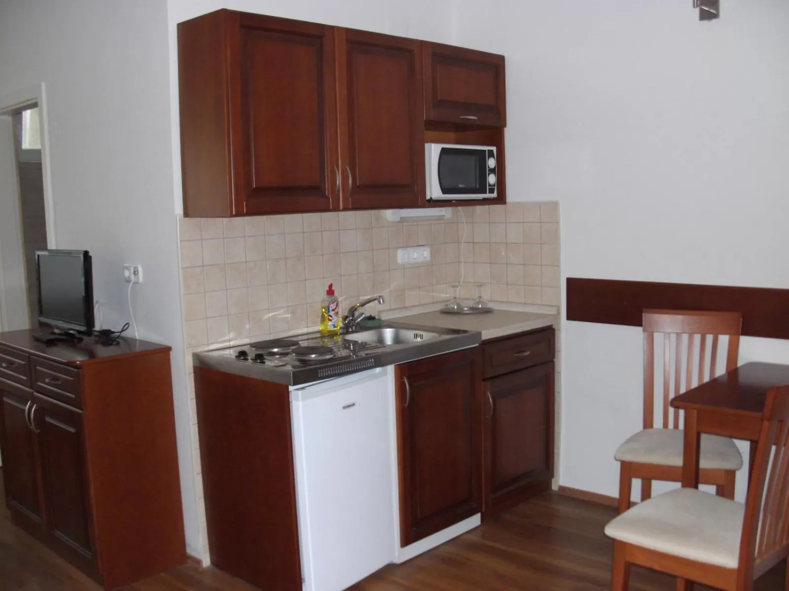 Kitchen or kitchenette in Szieszta Panzió