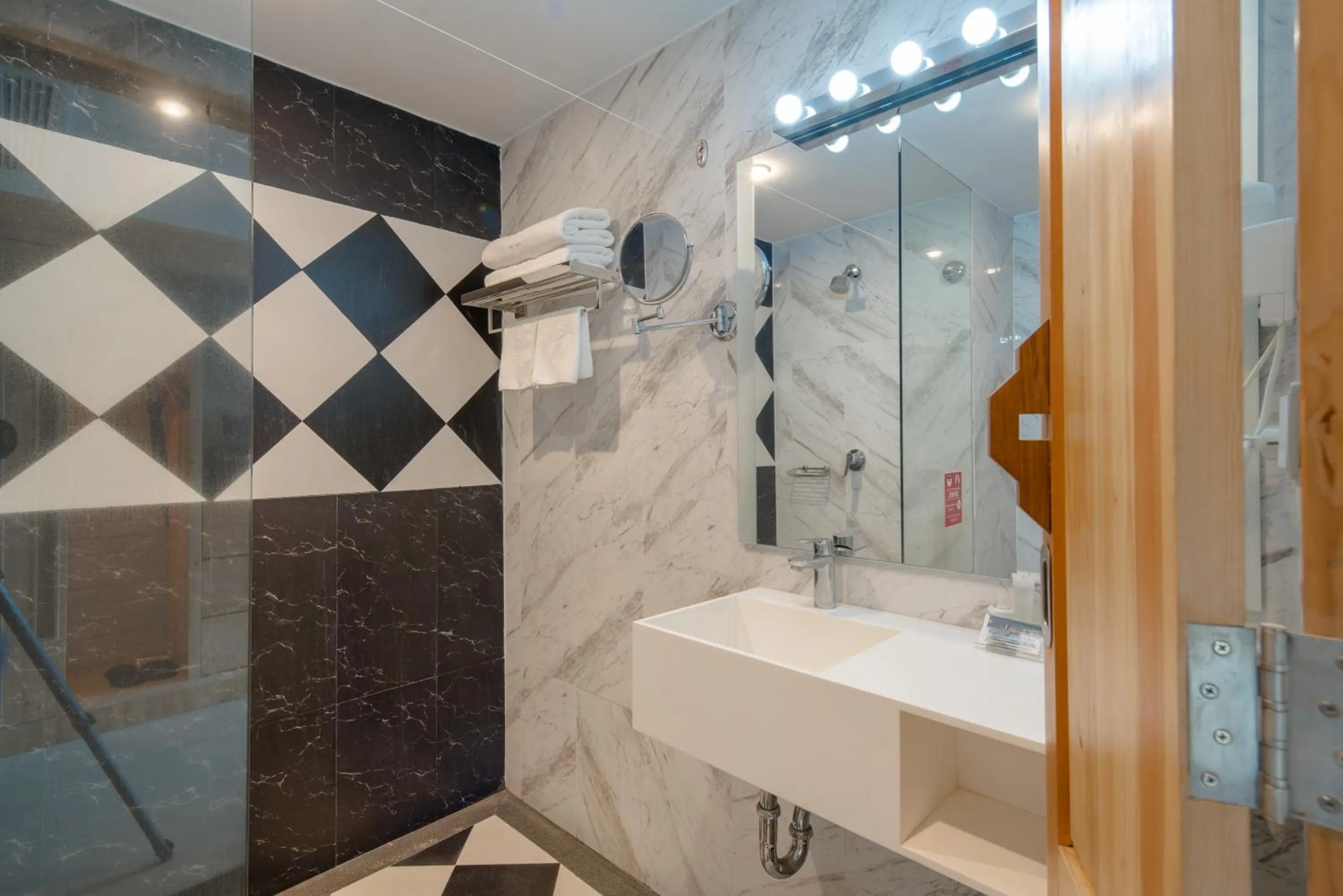 Bathroom in DARA Hotel - SHA Plus