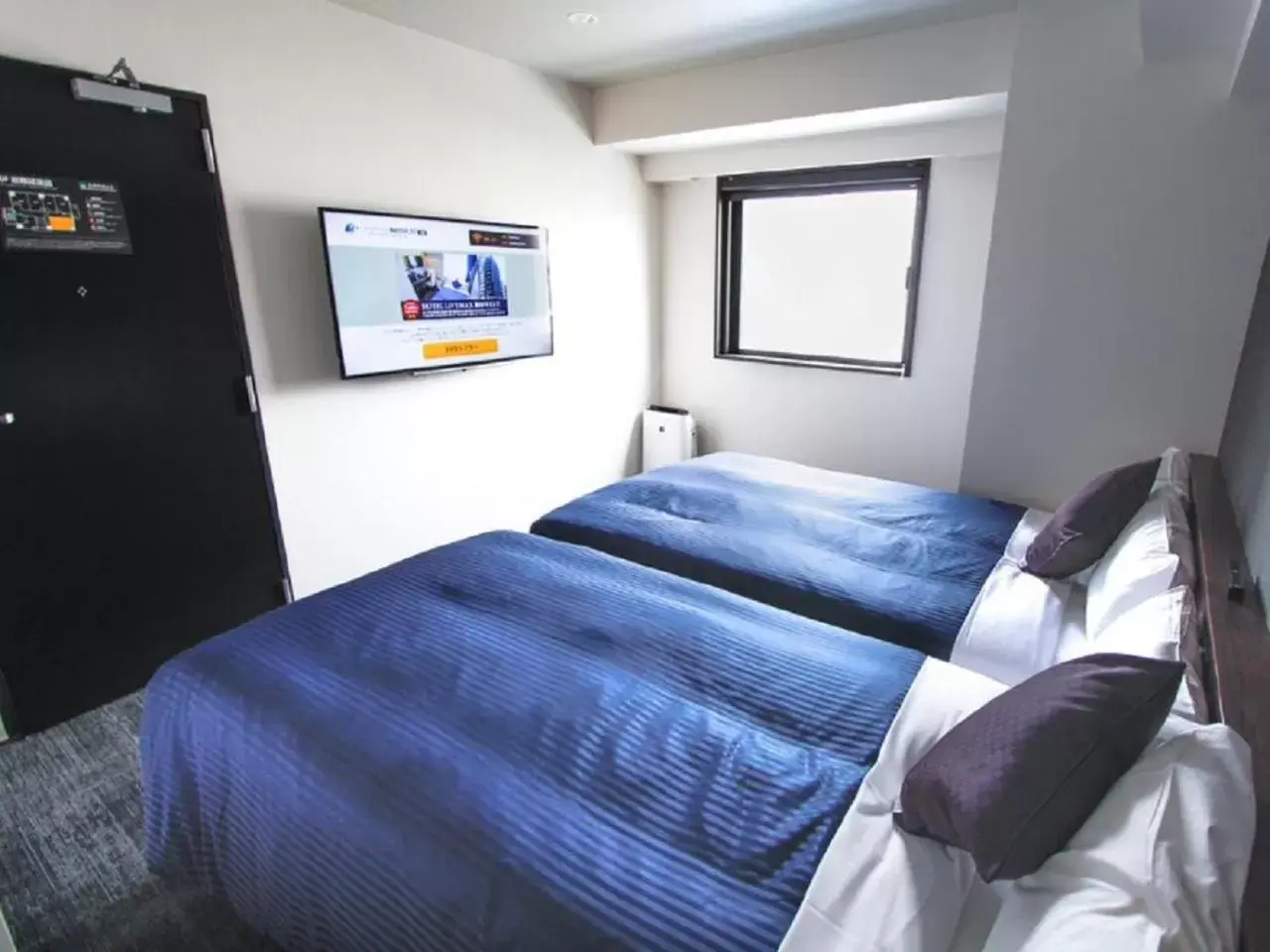 Bed in HOTEL LiVEMAX Umeda WEST