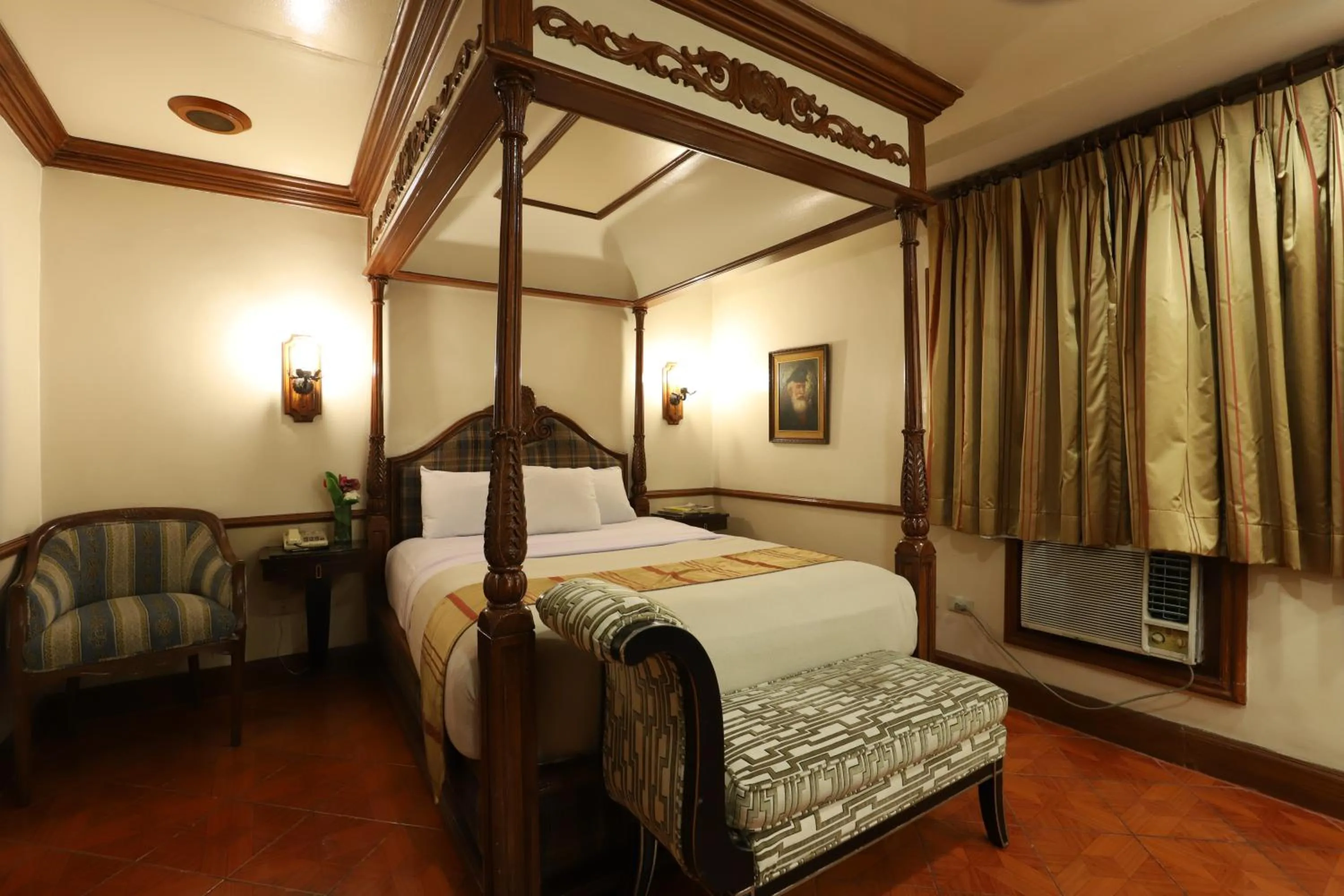 Bed in Camelot Hotel