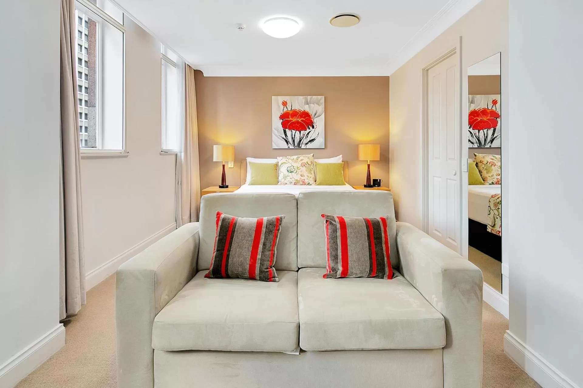 Seating area, Bed in Manor Apartment Hotel