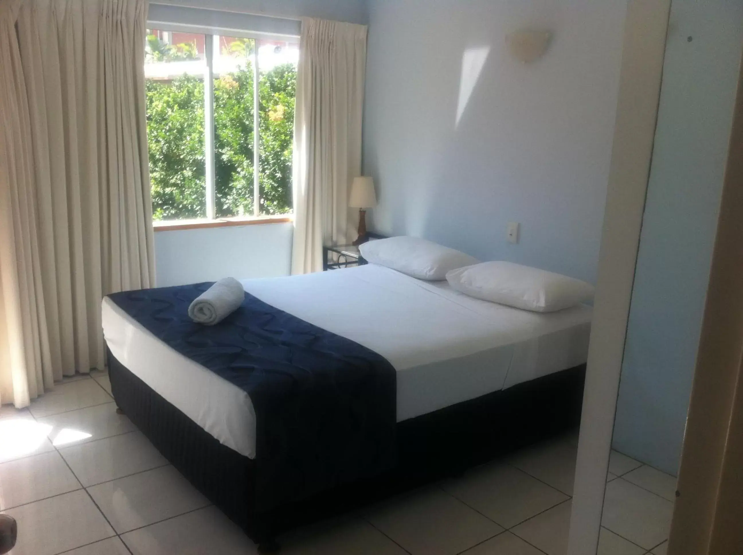 Bed in Reef Gateway Apartments