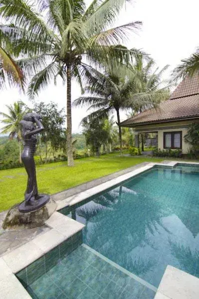 Garden, Swimming Pool in Hotel Puri Asri