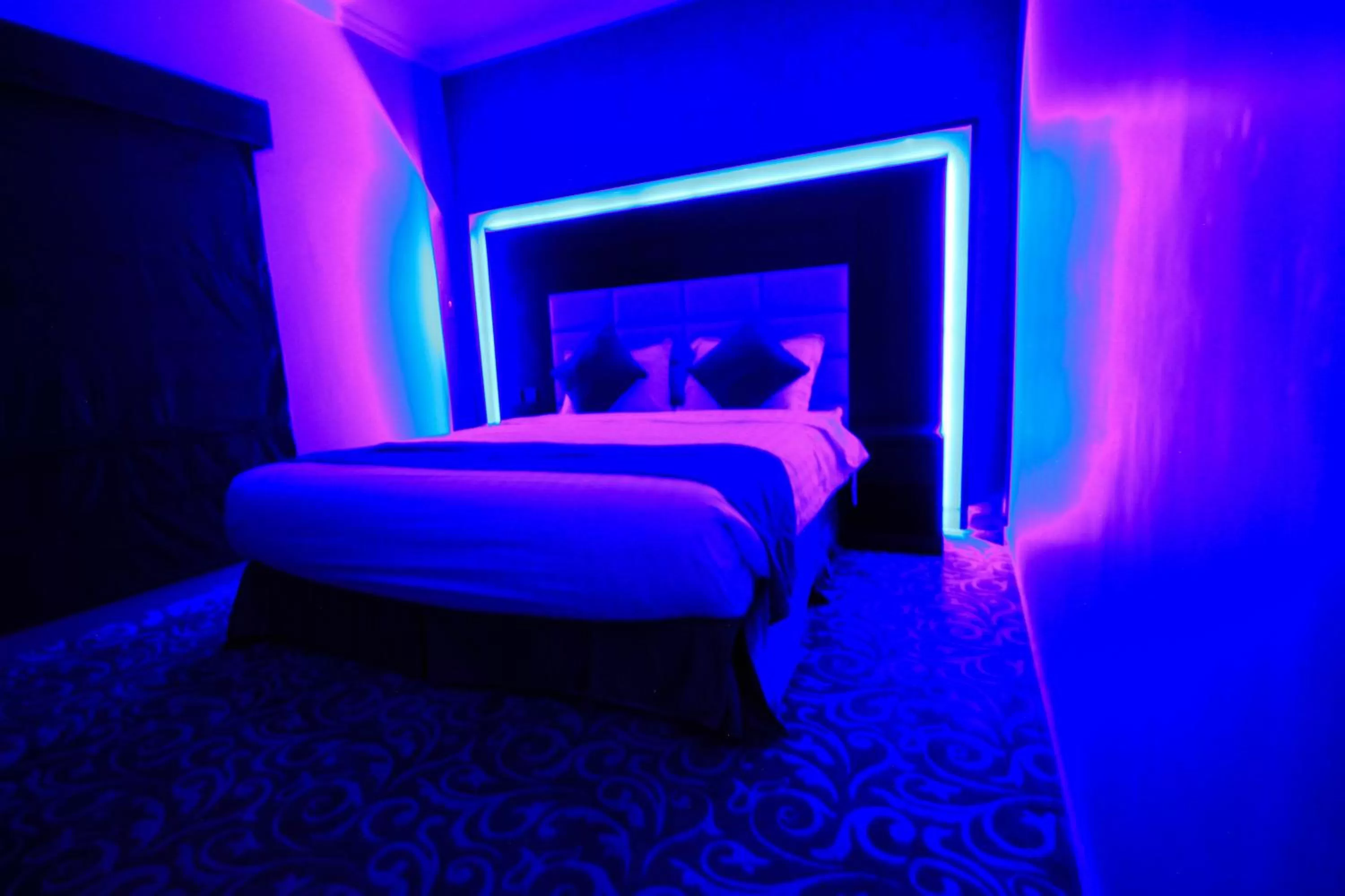 Bed in Maskan Al Dyafah Hotel Apartments