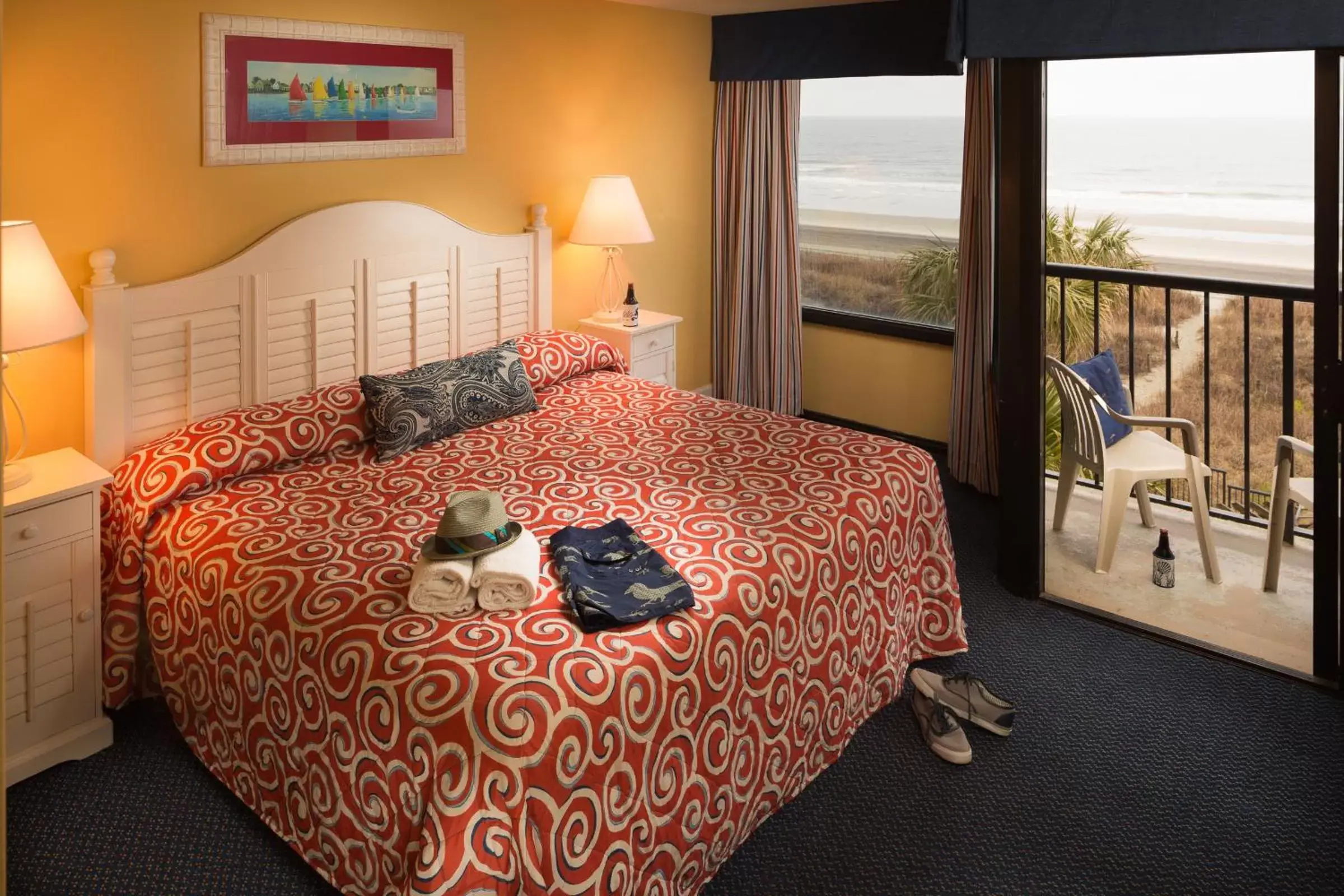 Balcony/Terrace, Bed in Ocean Club Resort Myrtle Beach a Ramada by Wyndham