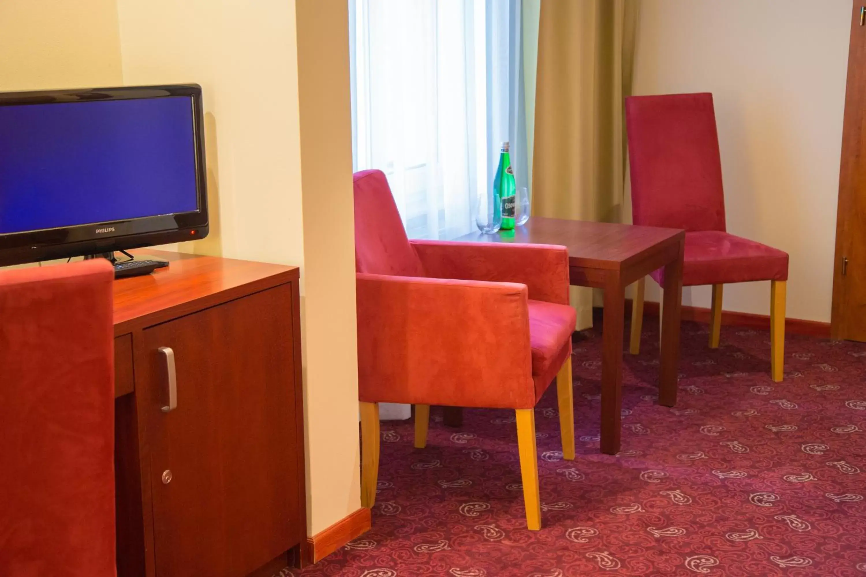 TV and multimedia, TV/Entertainment Center in Hotel Atol