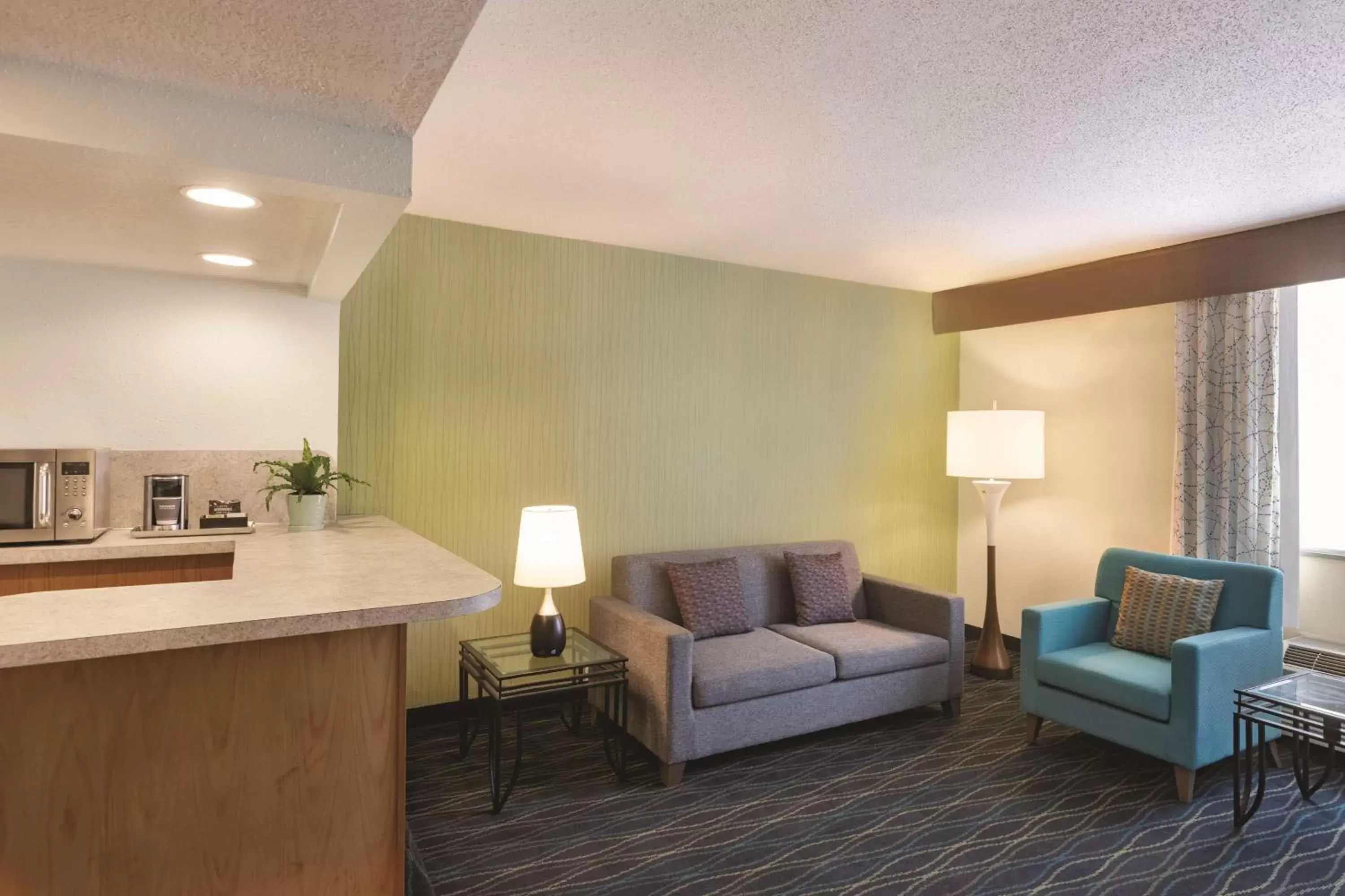 Photo of the whole room, Seating Area in Radisson Hotel Grand Rapids Riverfront