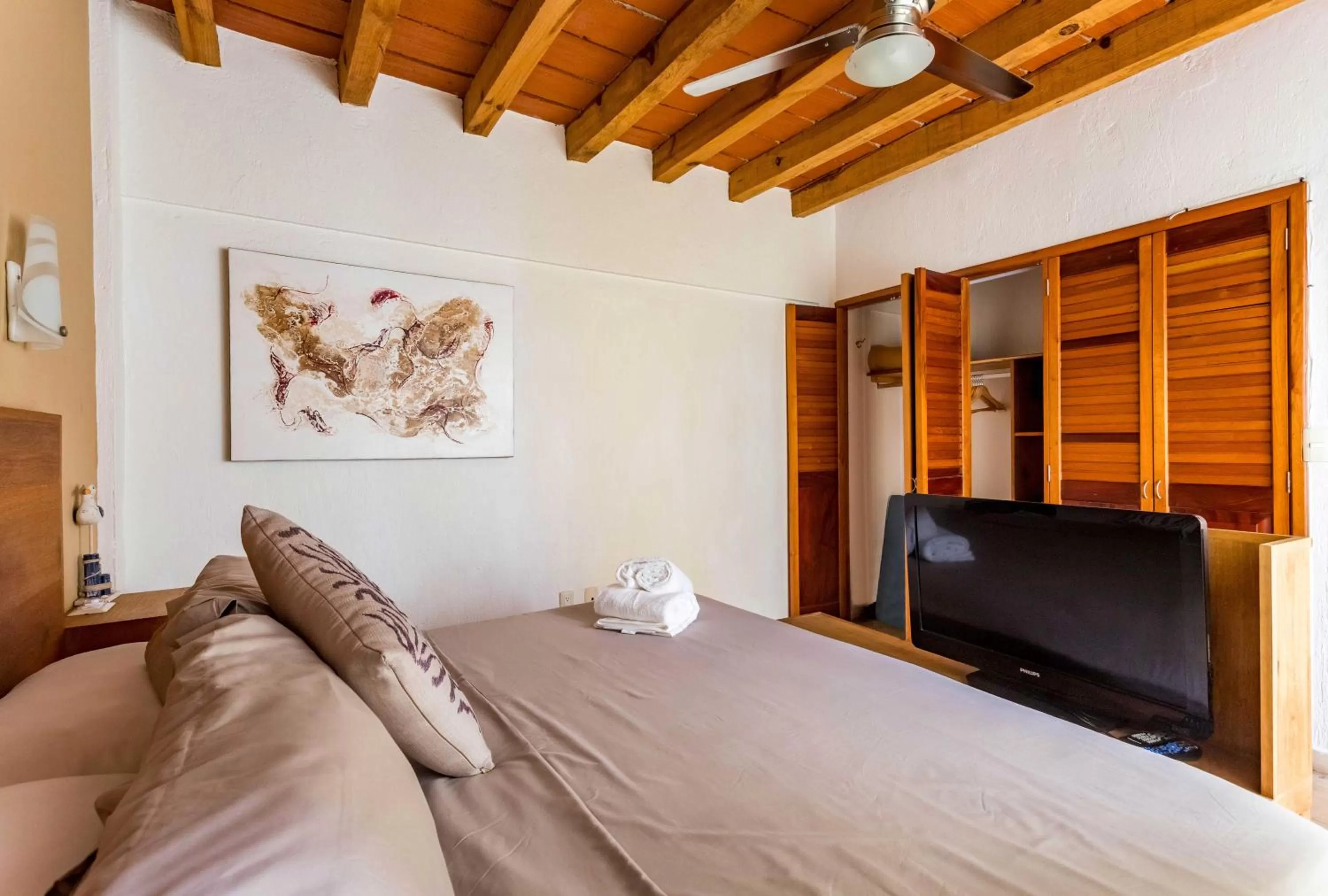 Bed in Olas Altas Suites Departamentos