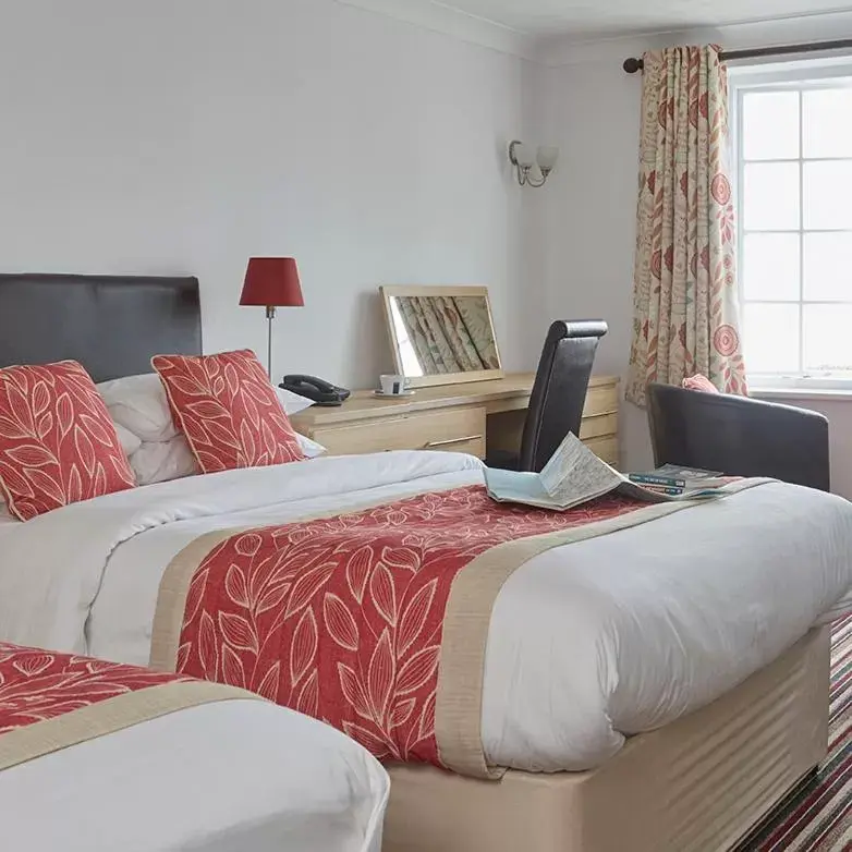 Bed in Luccombe Manor Country House Hotel