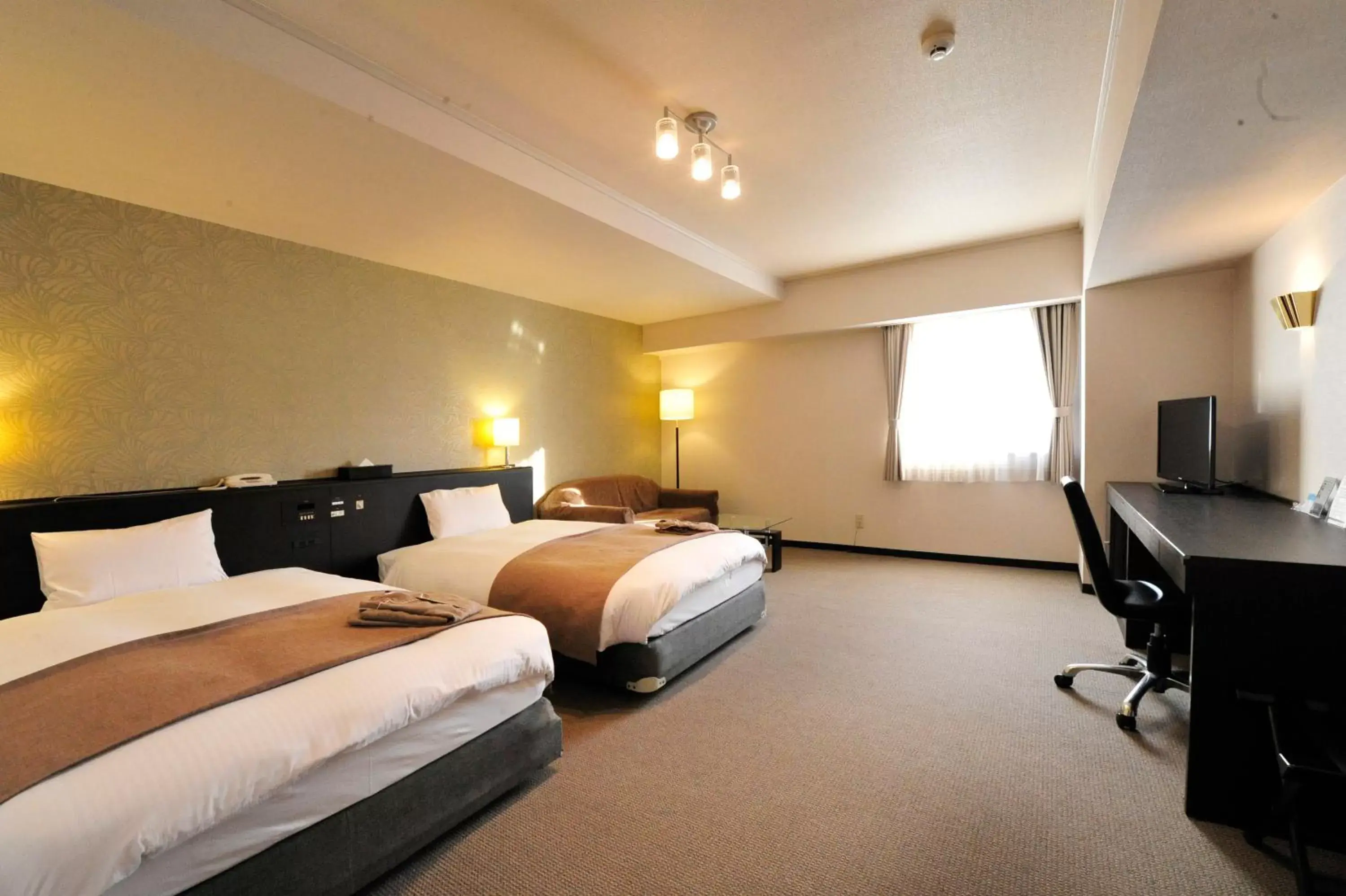 Bed in Hotel Royal Stay Sapporo