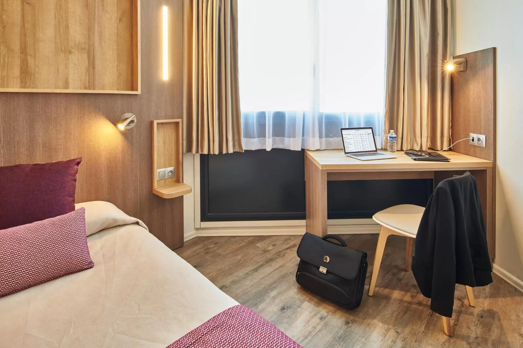 Bed in Hôtel Le Bayonne Bed in Hôtel Le Bayonne