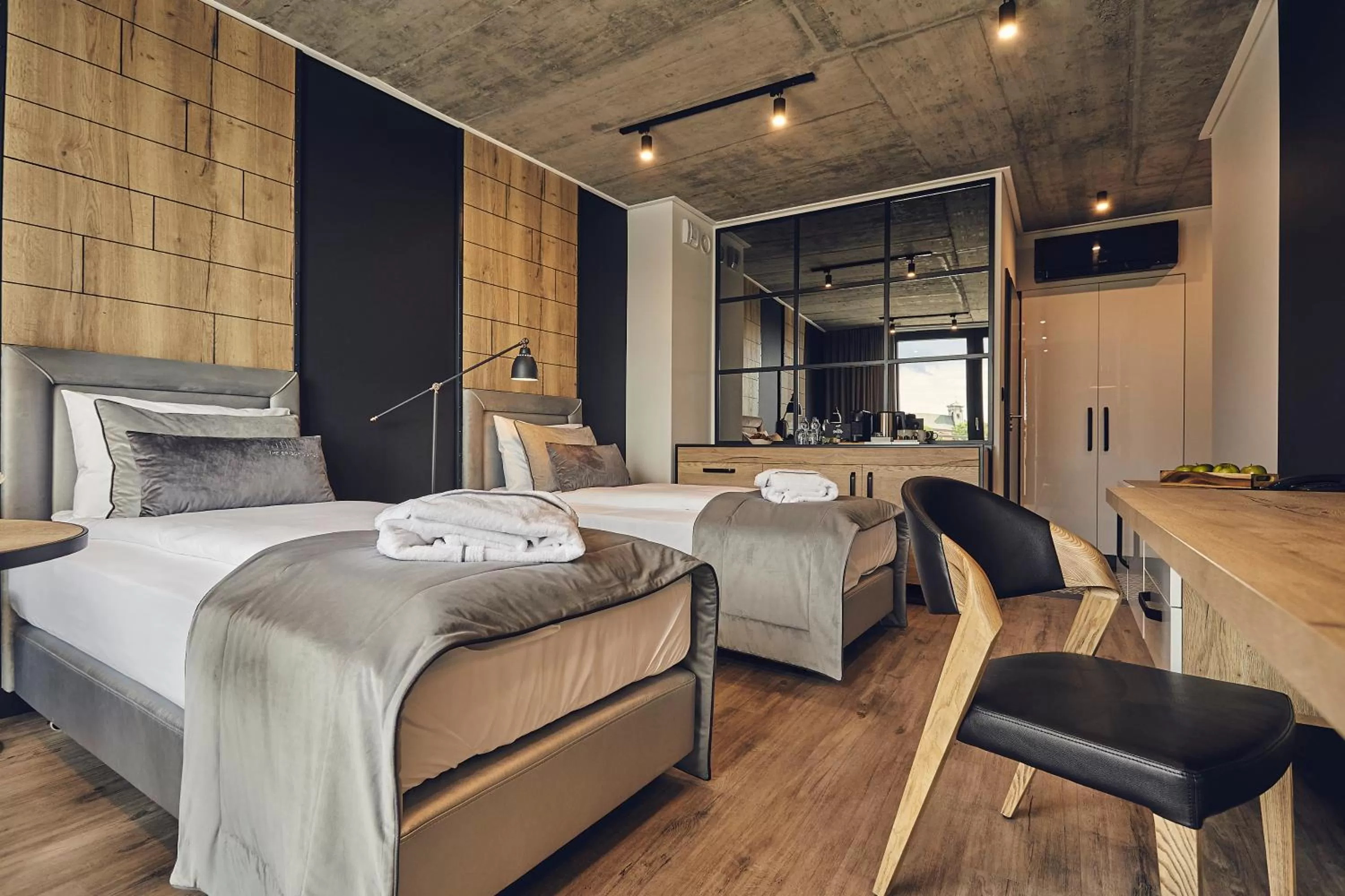 Kitchen or kitchenette, Bed in The Bridge Suites Hotel