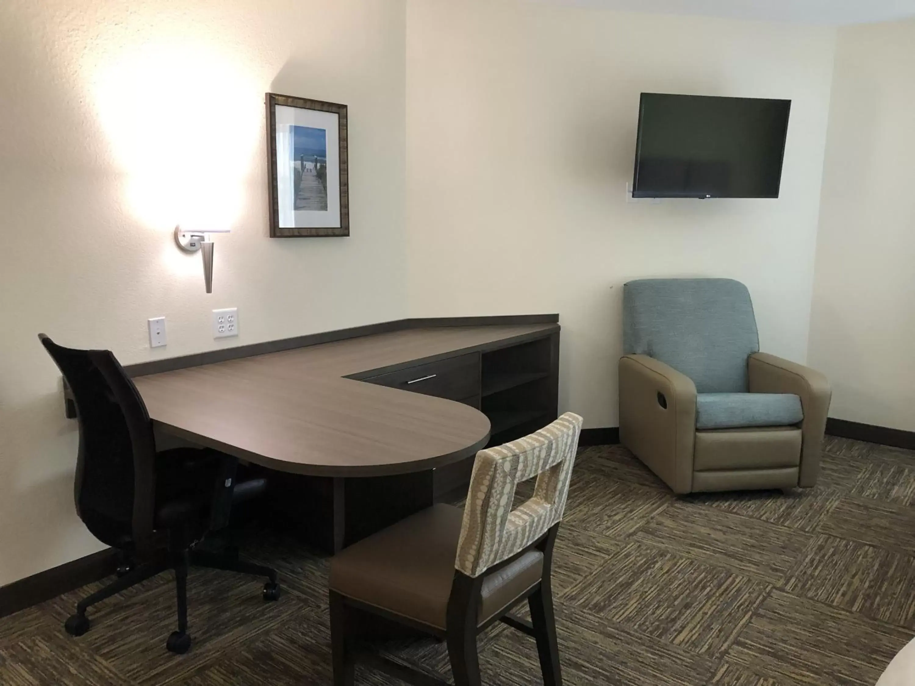 Seating area, TV/Entertainment Center in Candlewood Suites - Panama City Beach Pier Park, an IHG Hotel