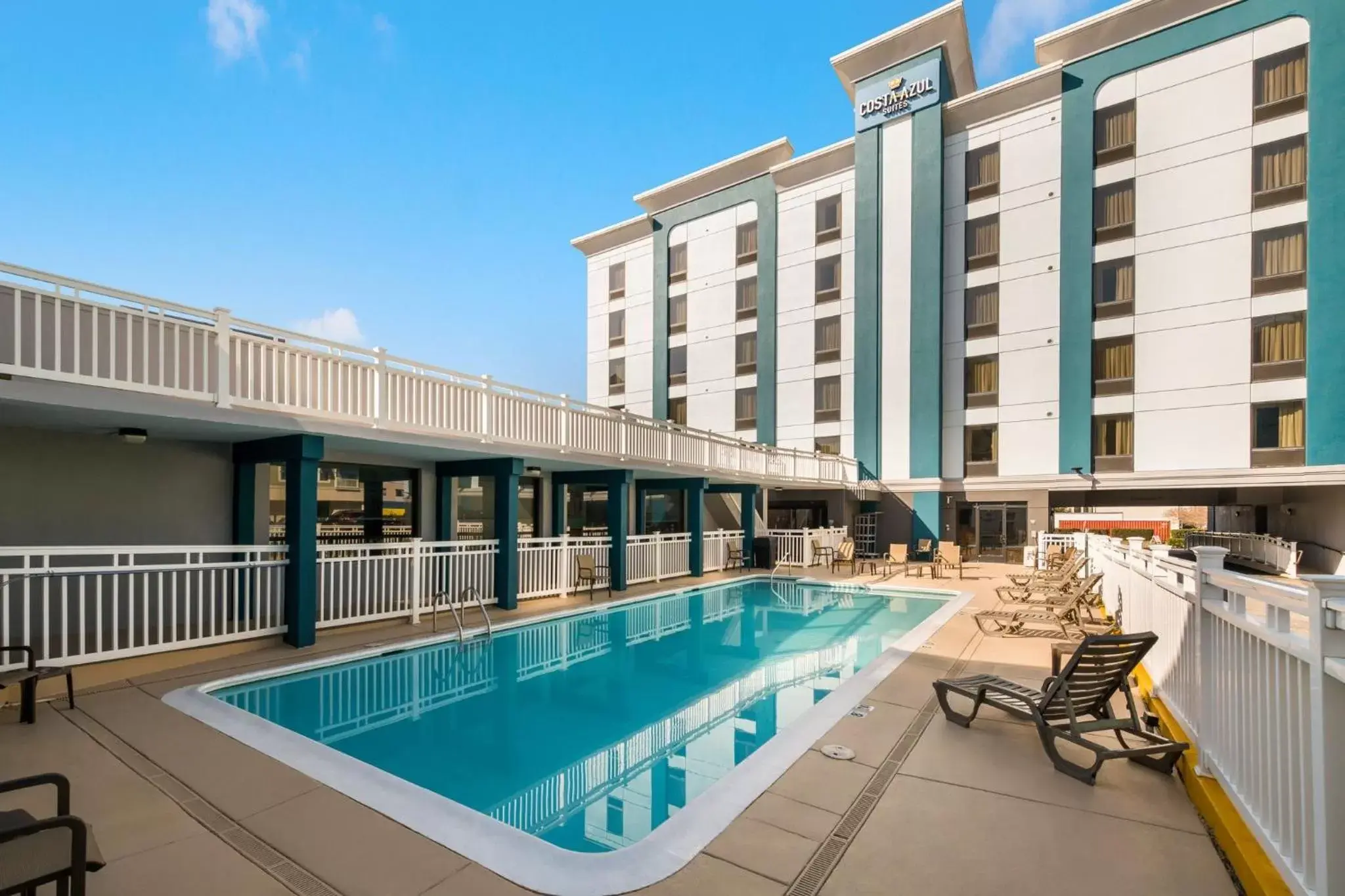 Swimming pool, Property Building in Costa Azul Suites Virginia Beach by Red Collection