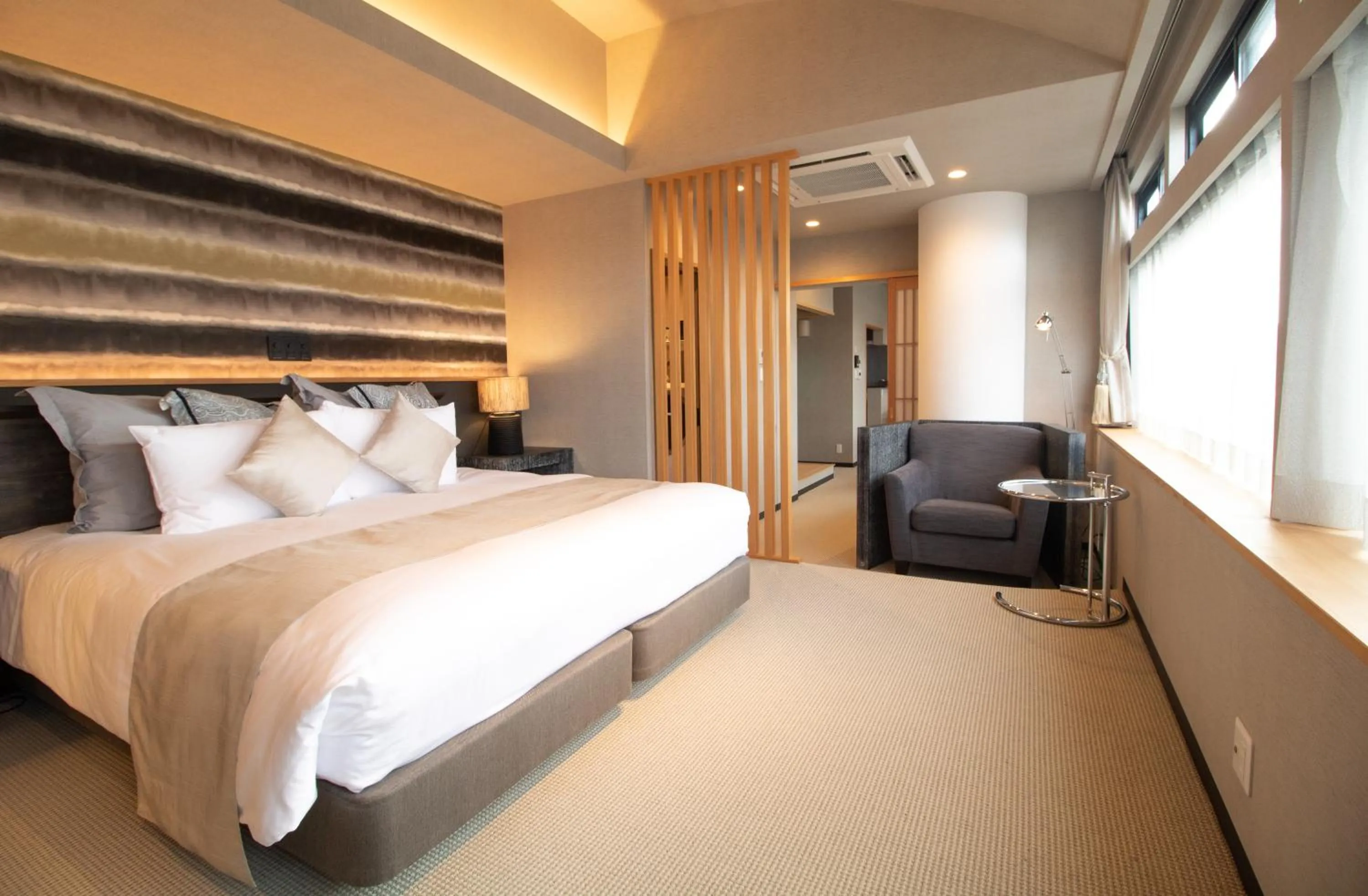 Bed in R&Run Kyoto Serviced Apartment & Suites