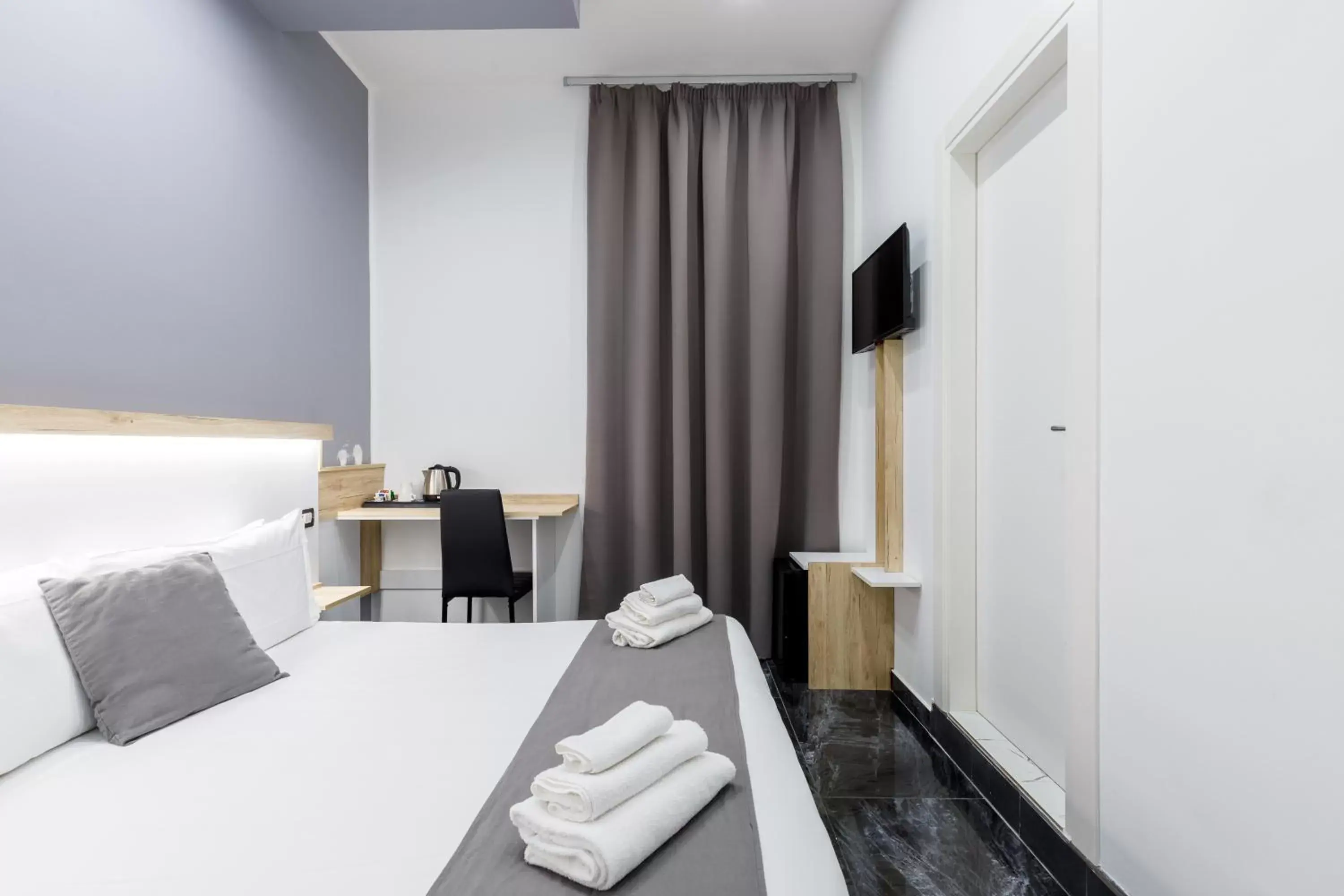 Bed in Bella Napoli Suites