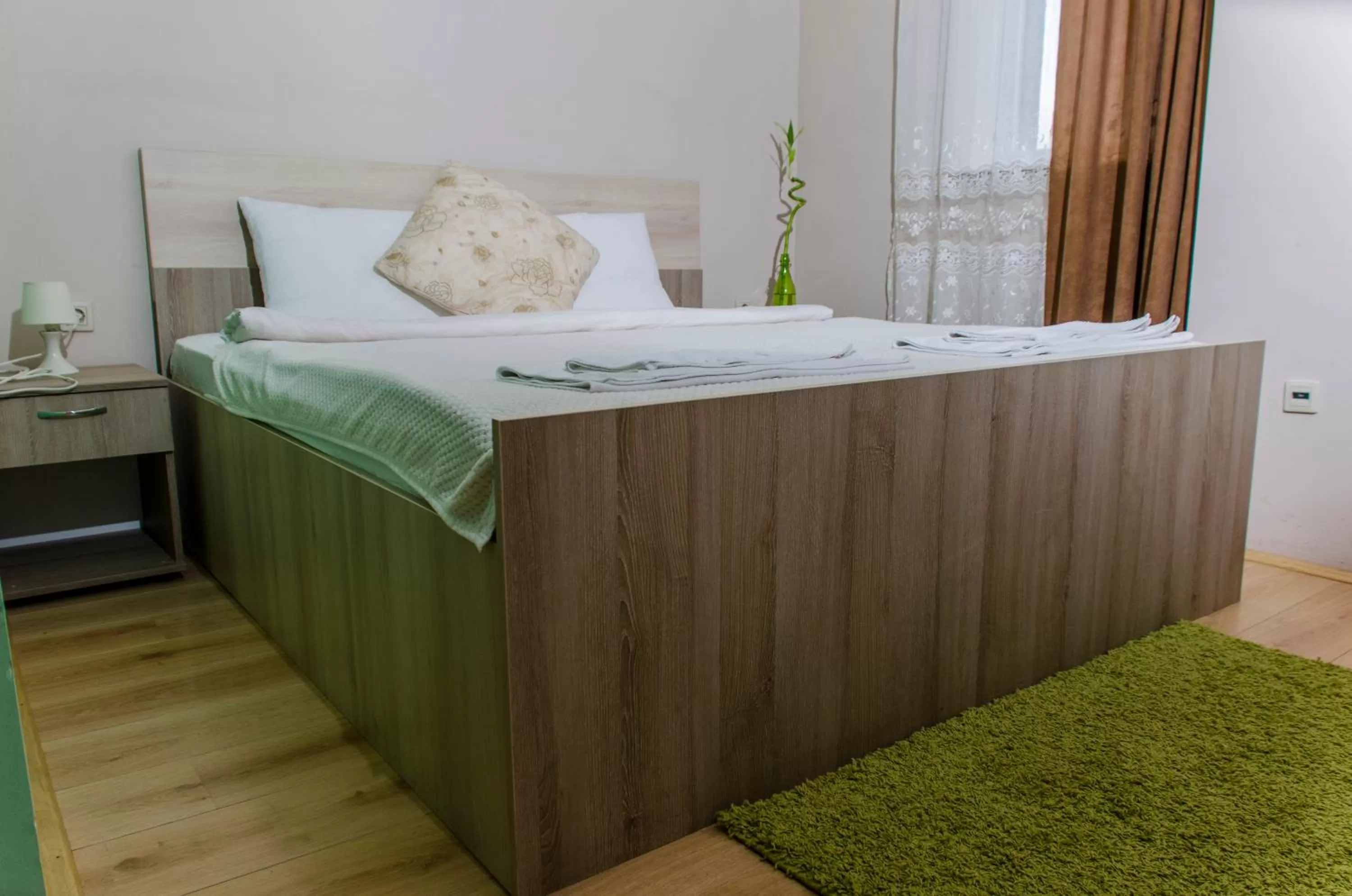 Bed in Garni Hotel Tri O