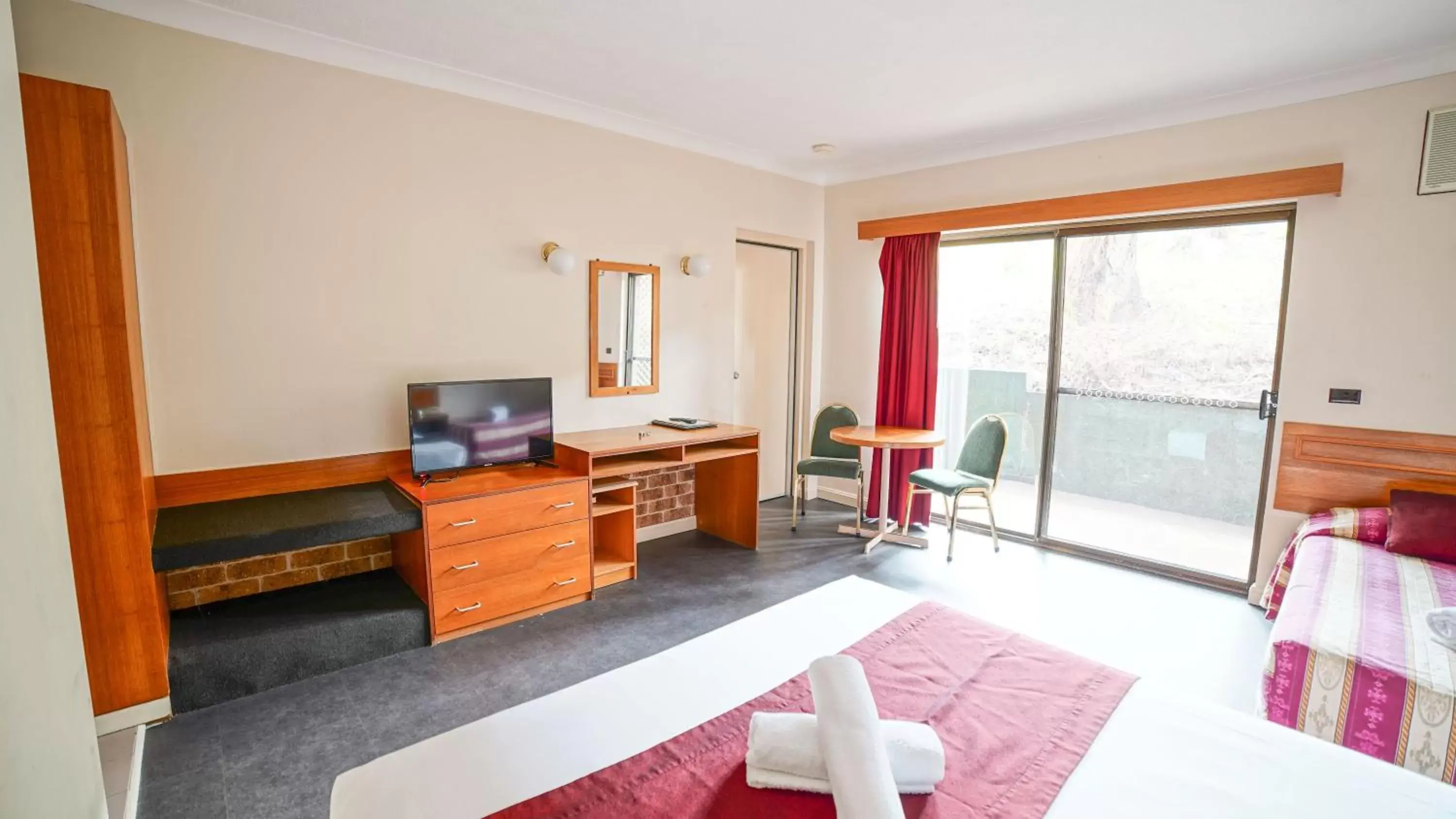 Photo of the whole room, TV/Entertainment Center in Country 2 Coast Motor Inn Coffs Harbour
