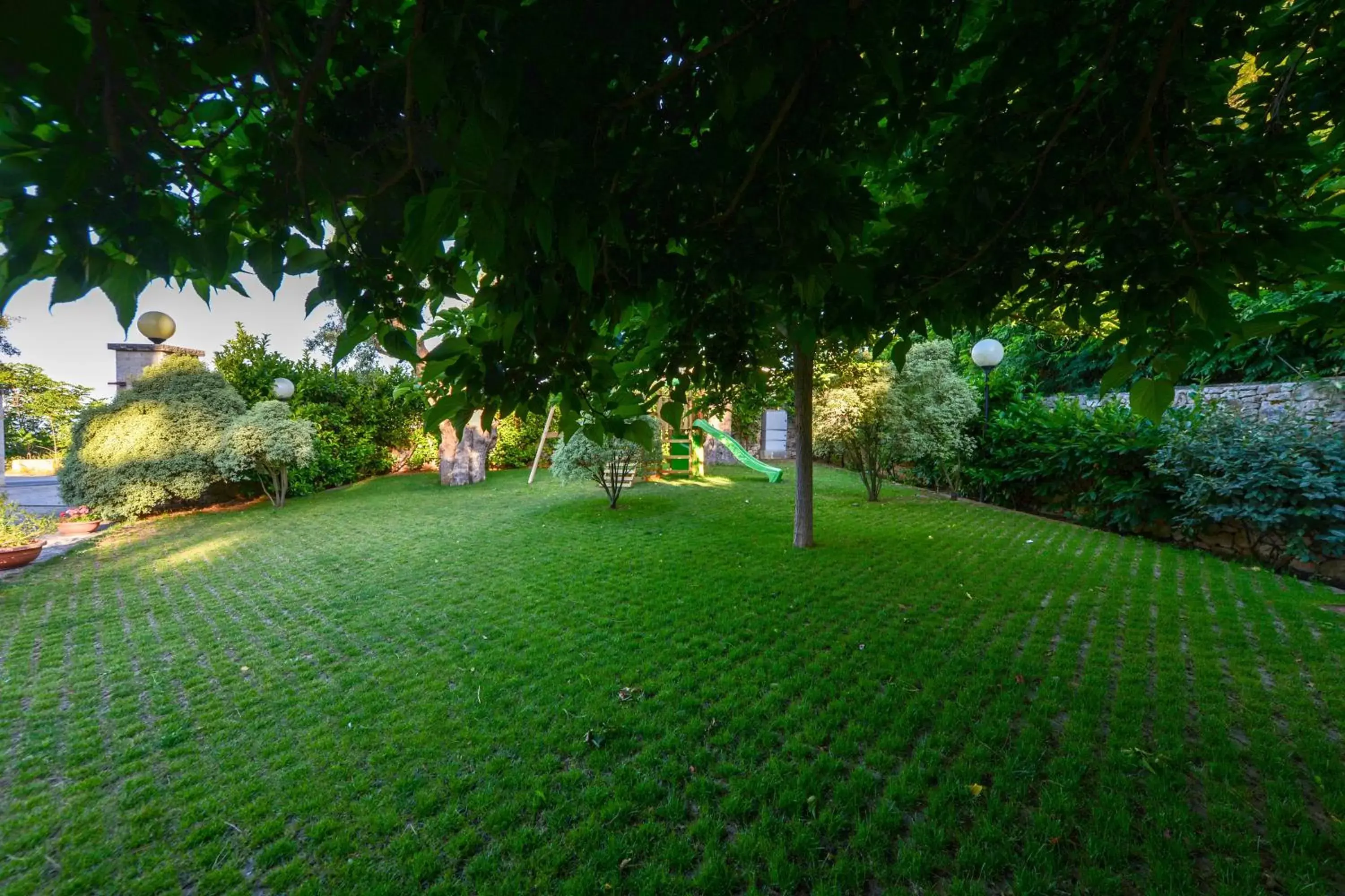 Children play ground, Garden in Hotel Castel Miramonti