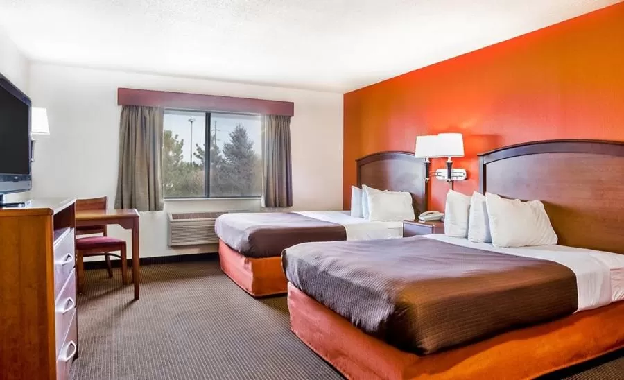 Bed in AmericInn by Wyndham Chamberlain Conference Center