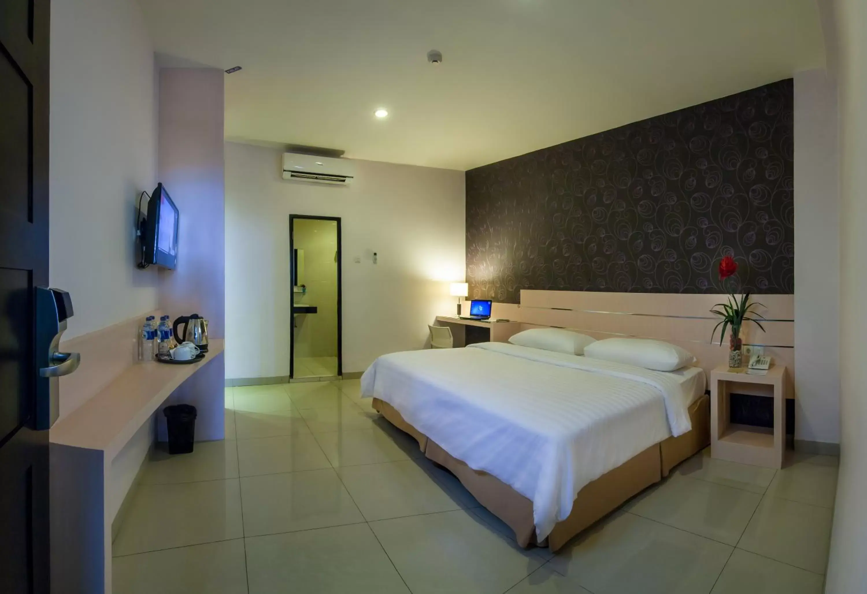 Photo of the whole room, Bed in Cordela Hotel Medan