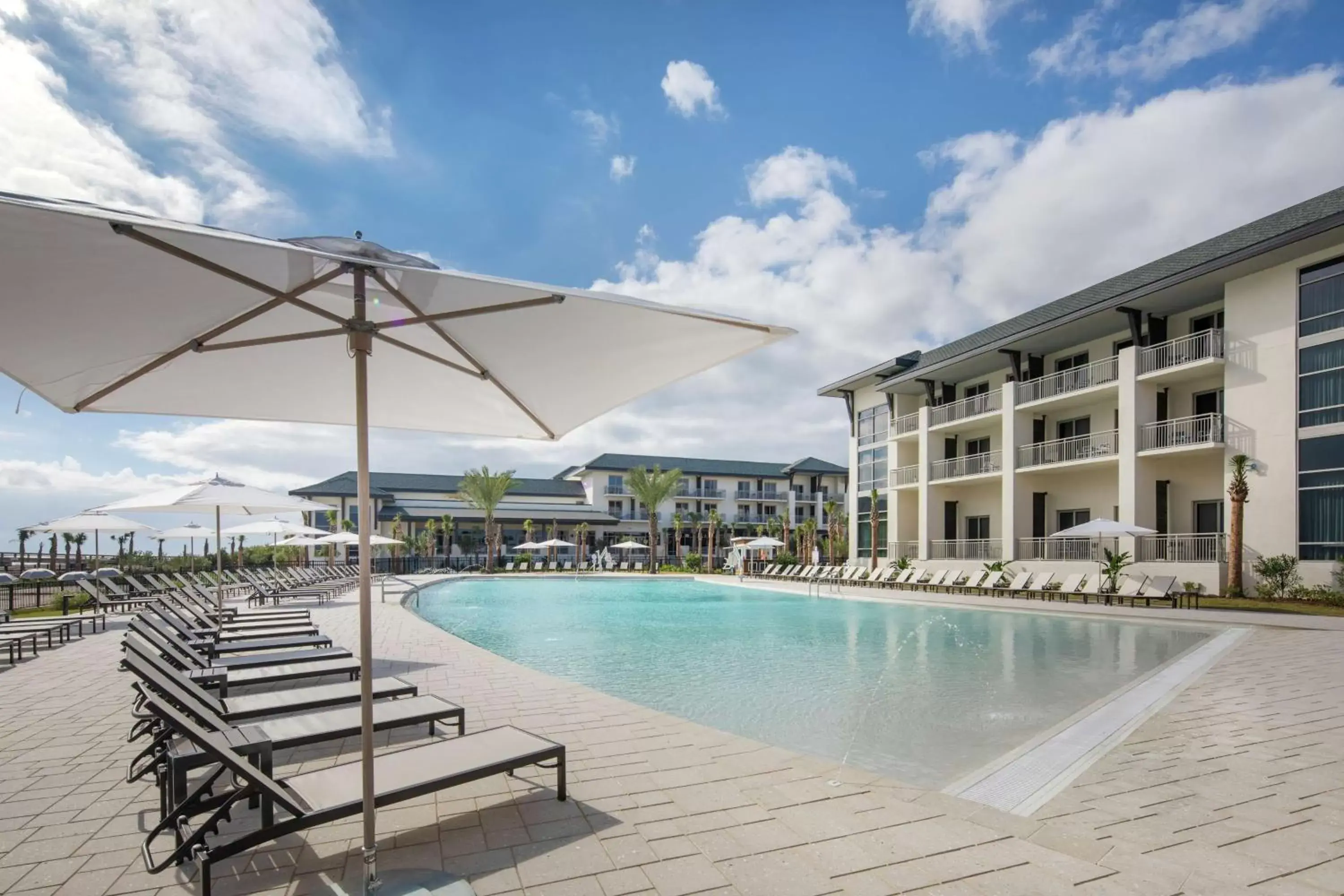 Property building, Swimming Pool in Embassy Suites St Augustine Beach Oceanfront Resort