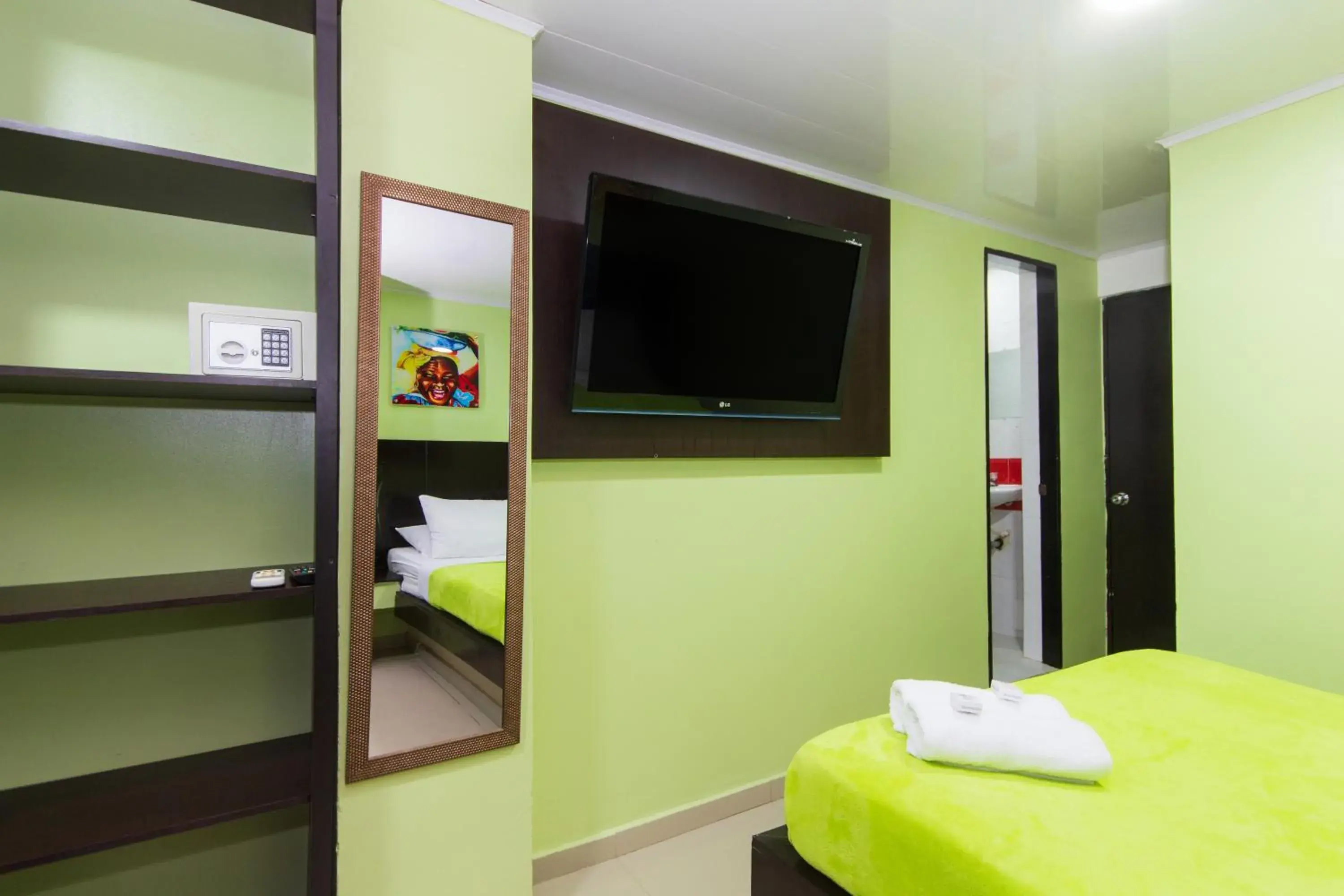 TV and multimedia, TV/Entertainment Center in Hotel Marina Suites By GEH Suites