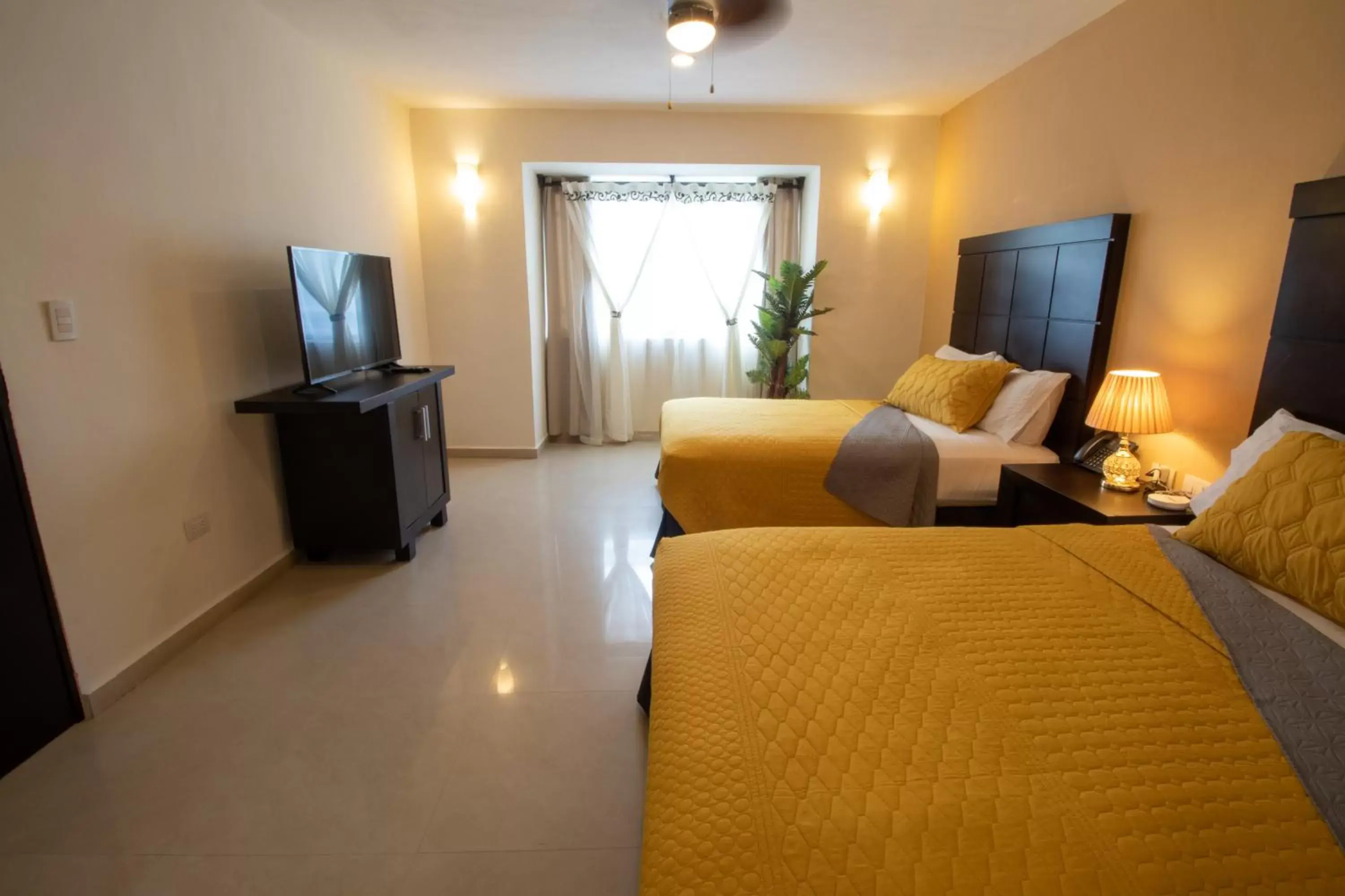 Photo of the whole room, TV/Entertainment Center in Hotel Villas Segovia Suites Playa del Carmen
