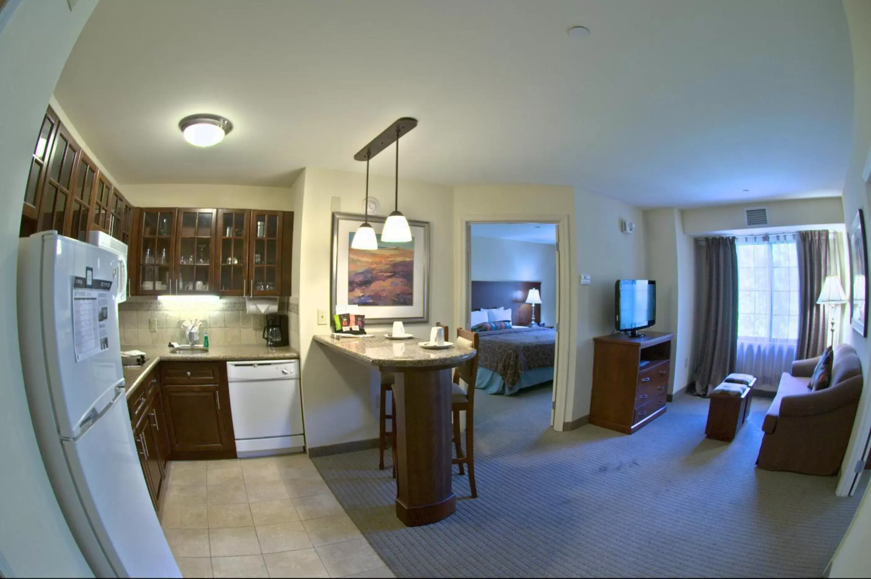 Living room, Kitchen/Kitchenette in Staybridge Suites East Stroudsburg - Poconos, an IHG Hotel