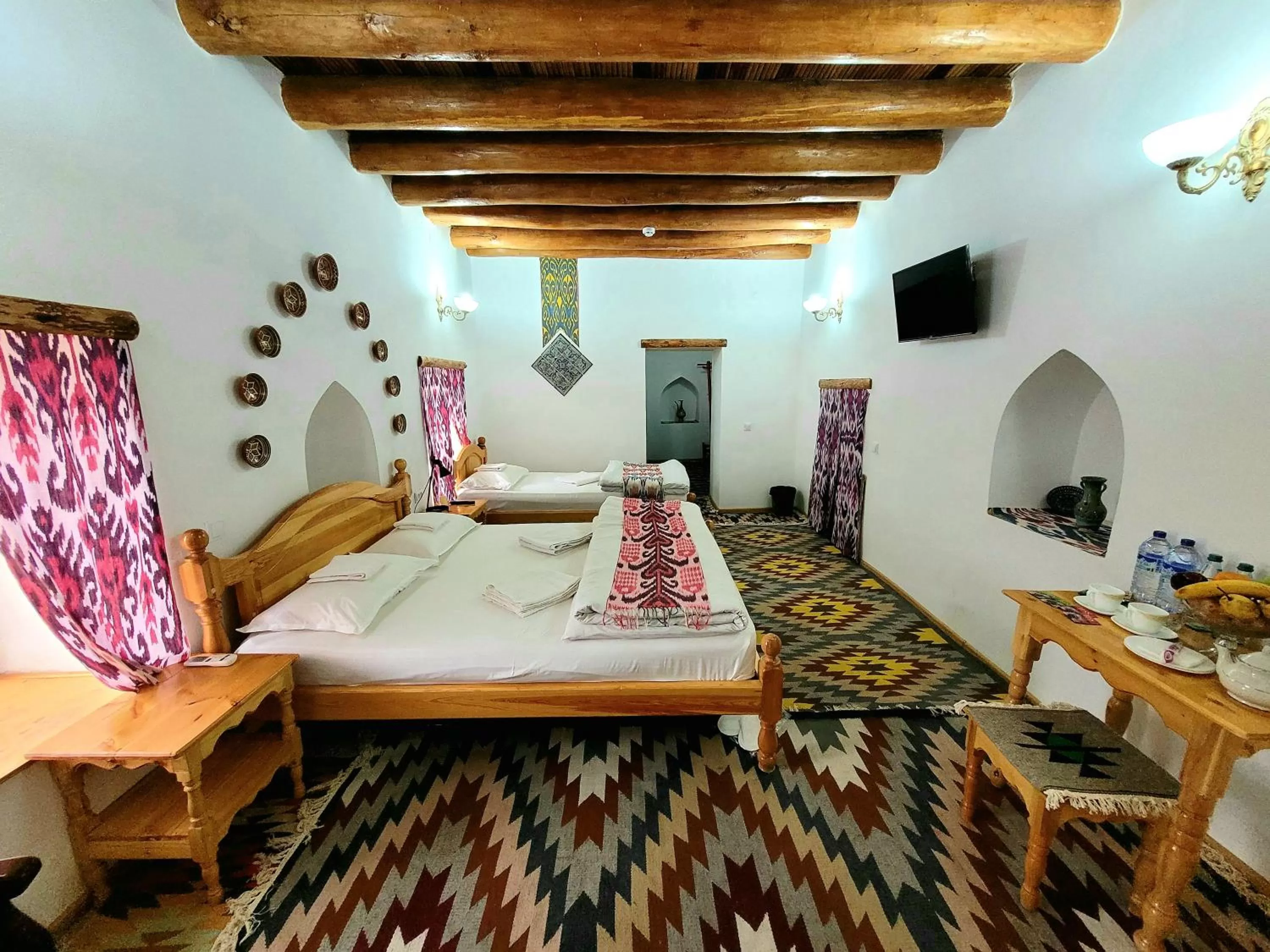 Bed in madrasah Polvon-Qori boutique hotel XIX century