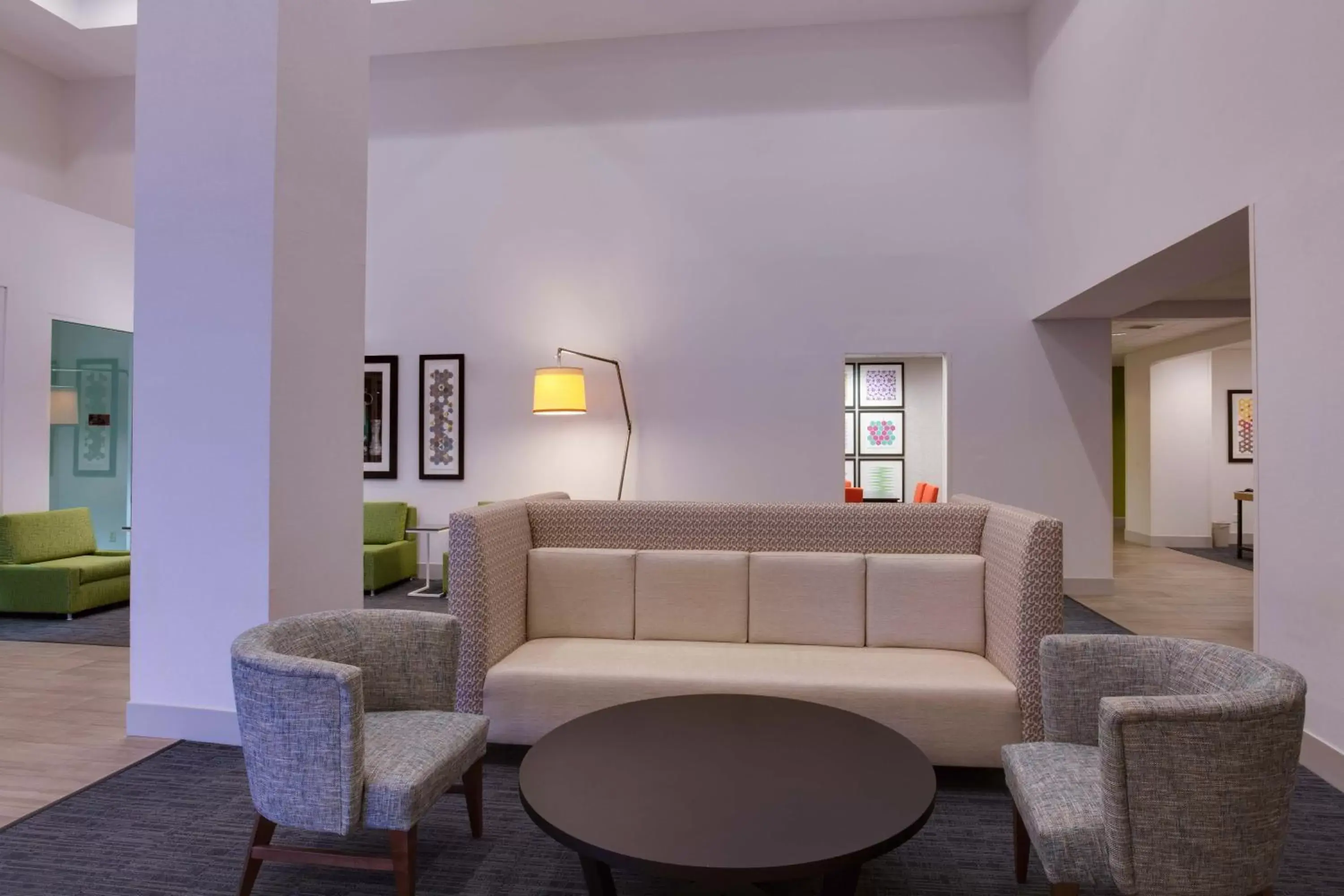 Lobby or reception, Seating Area in Holiday Inn Express & Suites Orlando International Airport, an IHG Hotel