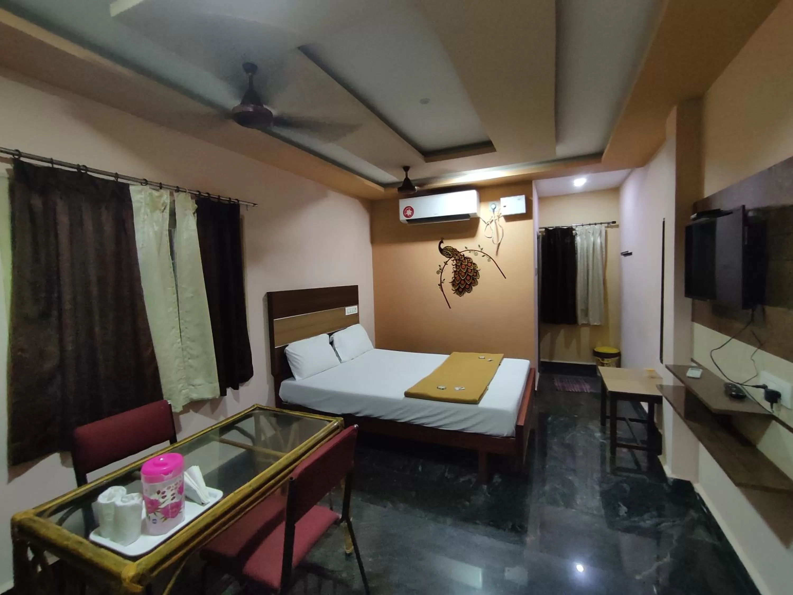 air conditioner, Bed in Sri Murugan Beach Paradise Hotel