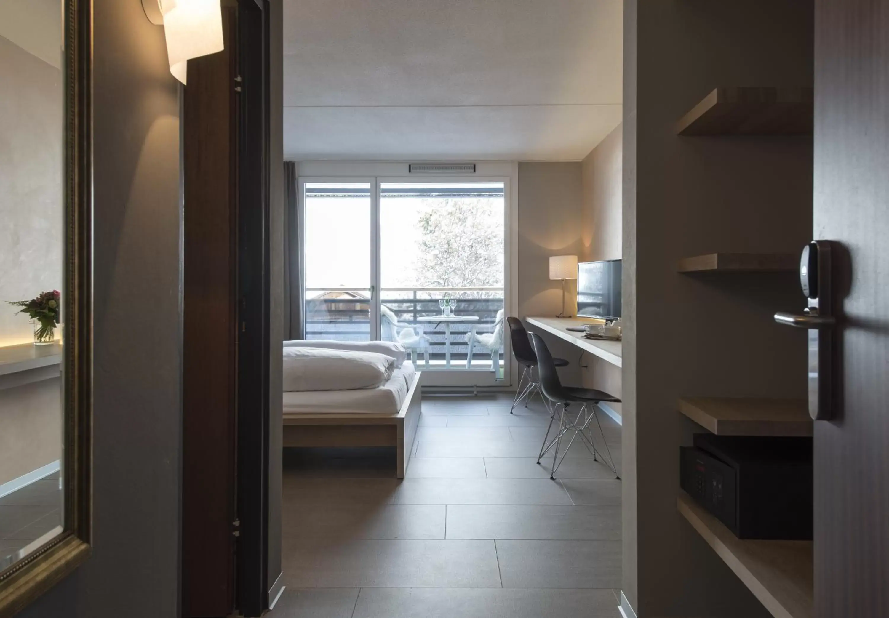 Bedroom in Hotel des Alpes