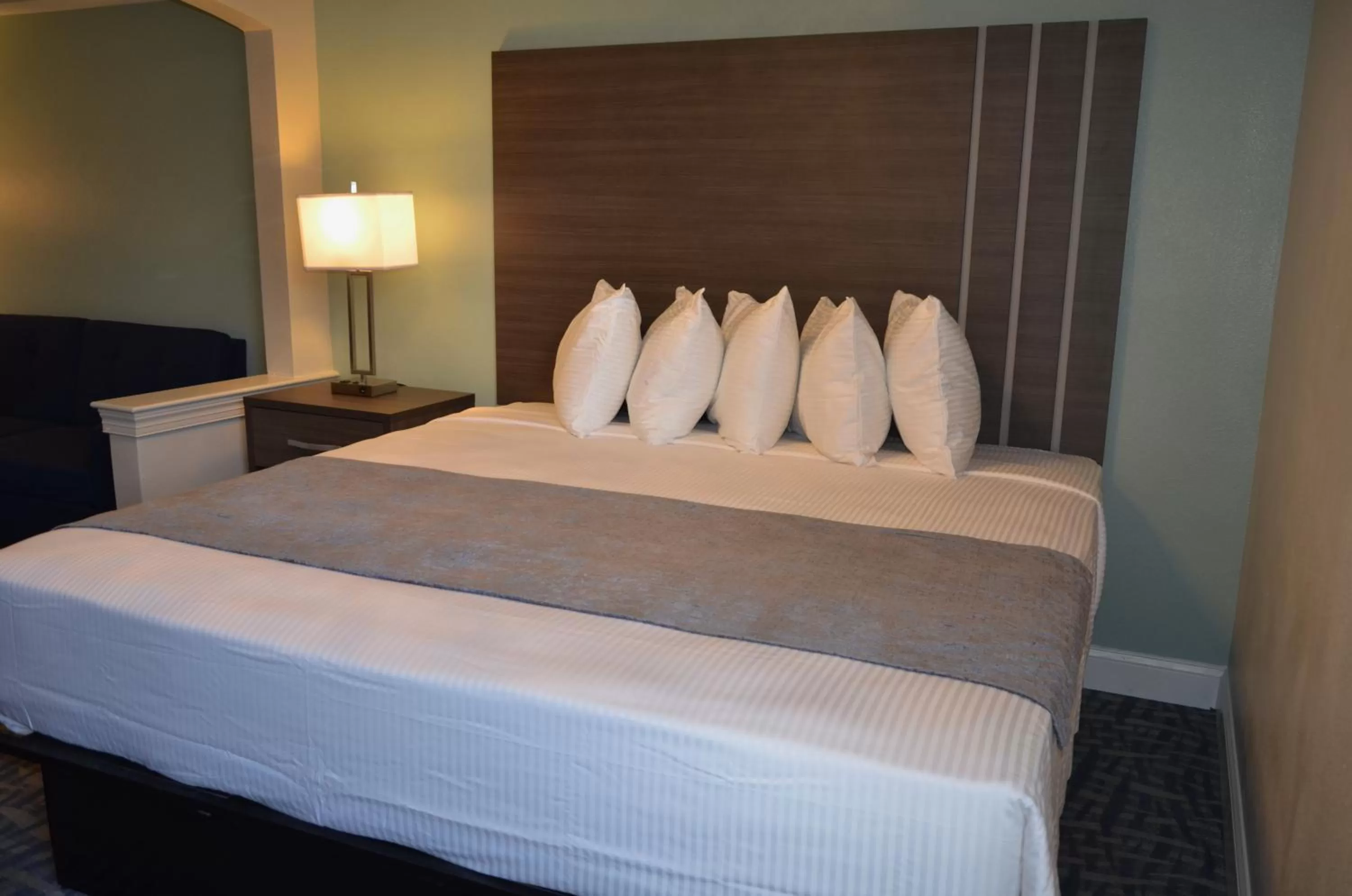 Bed in Opal Hotel & Suites