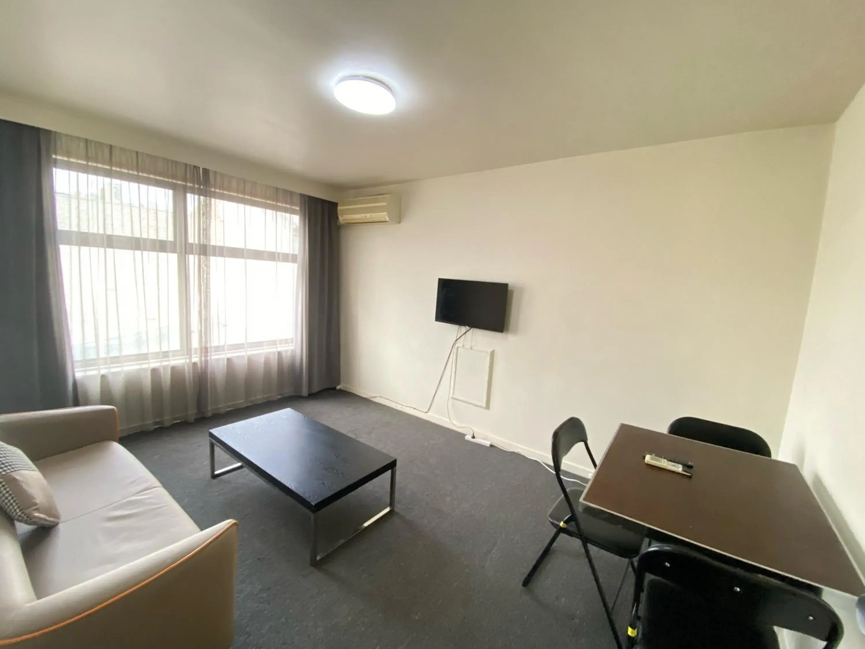 Living room, Seating Area in City Edge East Melbourne Apartment Hotel