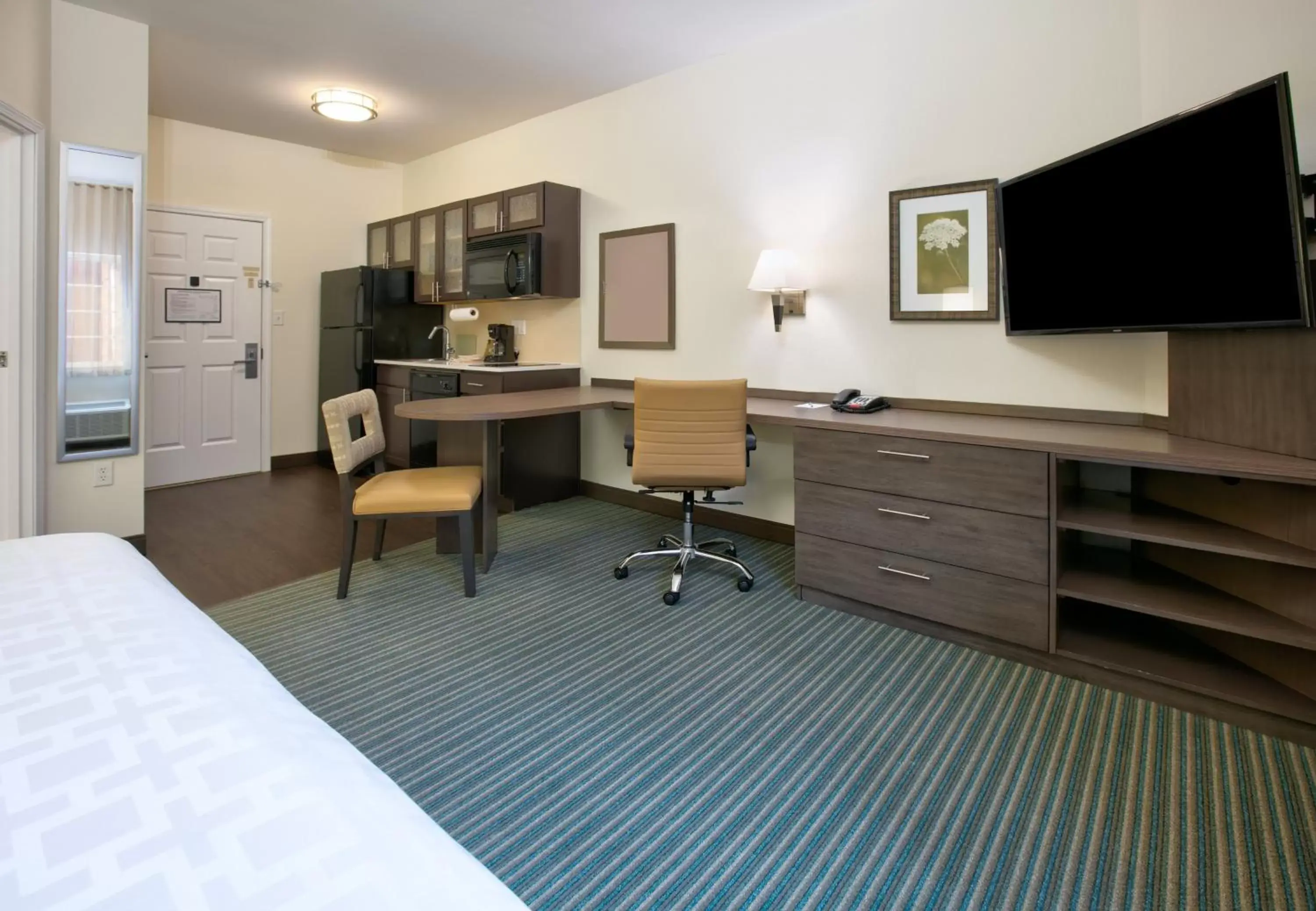 Photo of the whole room, TV/Entertainment Center in Candlewood Suites Dallas Fort Worth South, an IHG Hotel