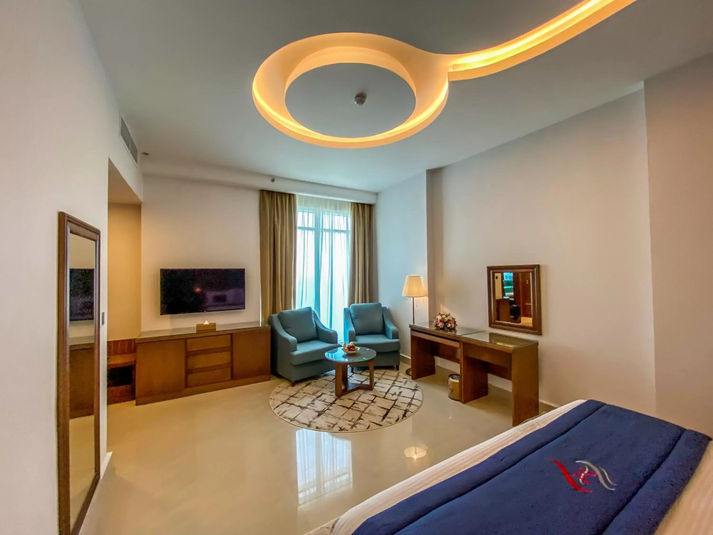 Seating area, TV/Entertainment Center in Mirage Bab Al Bahr Beach Hotel