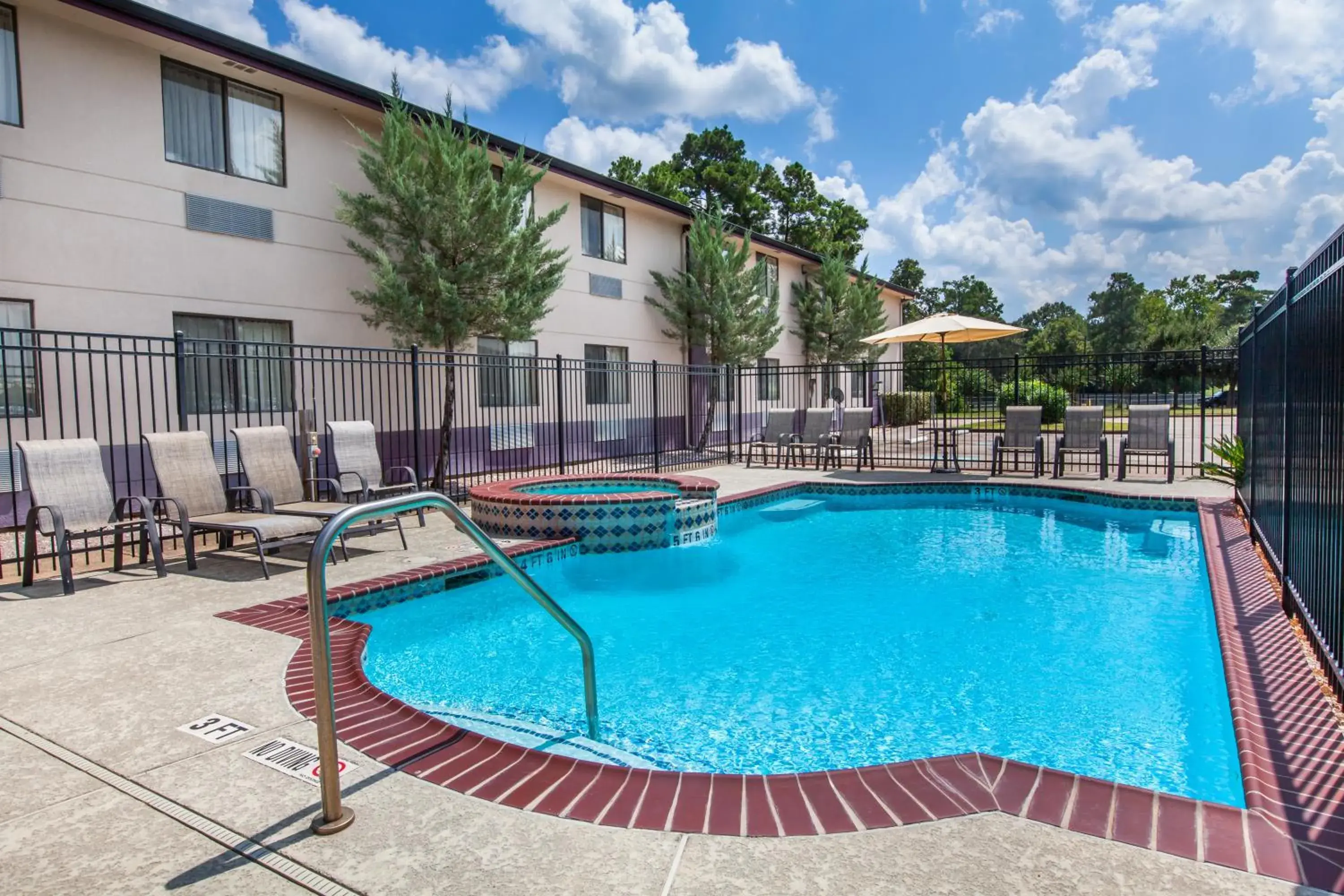 Property building, Swimming Pool in Super 8 by Wyndham Cleveland TX