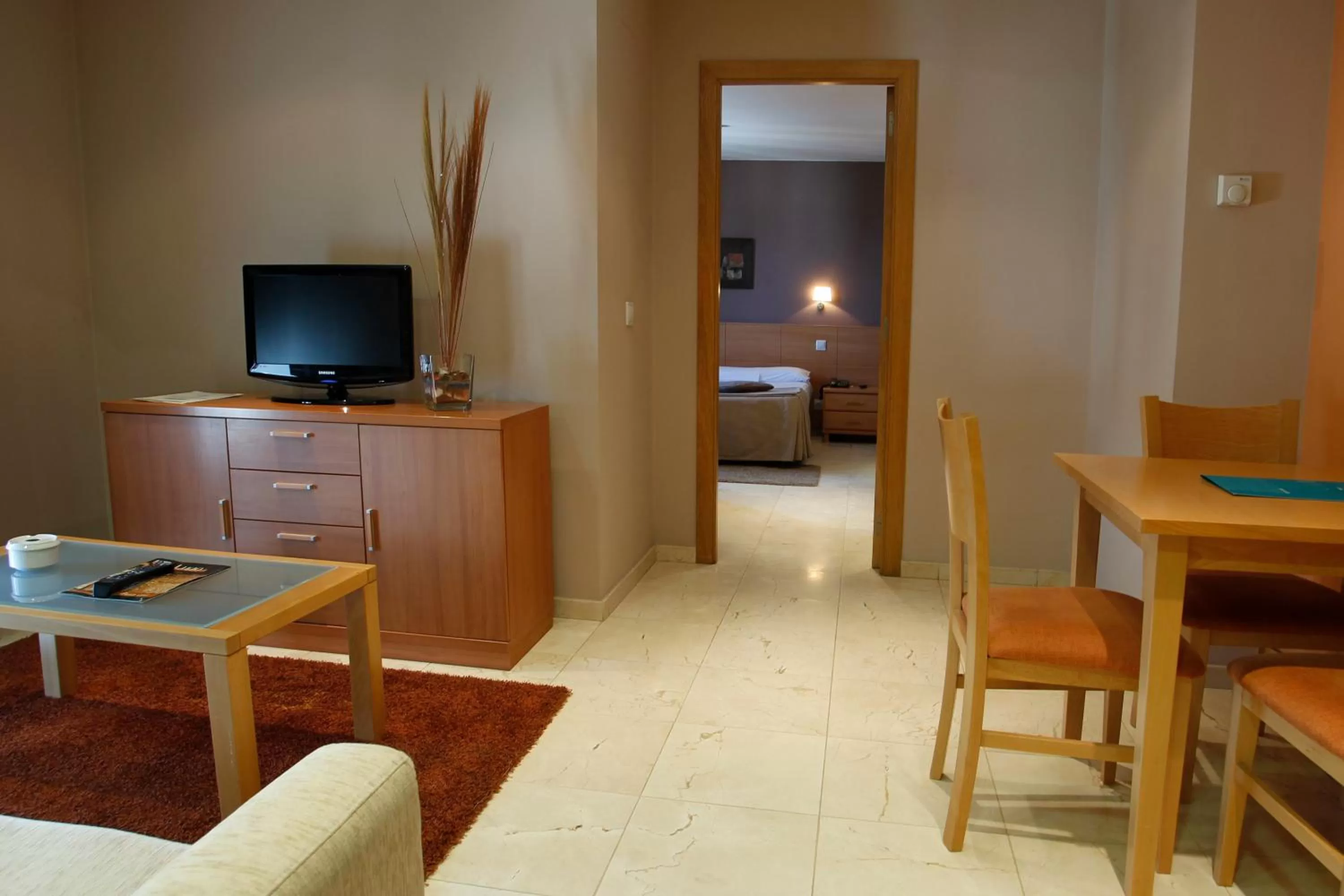 Living room, Bed in Hotel Apartamentos Ciudad de Lugo