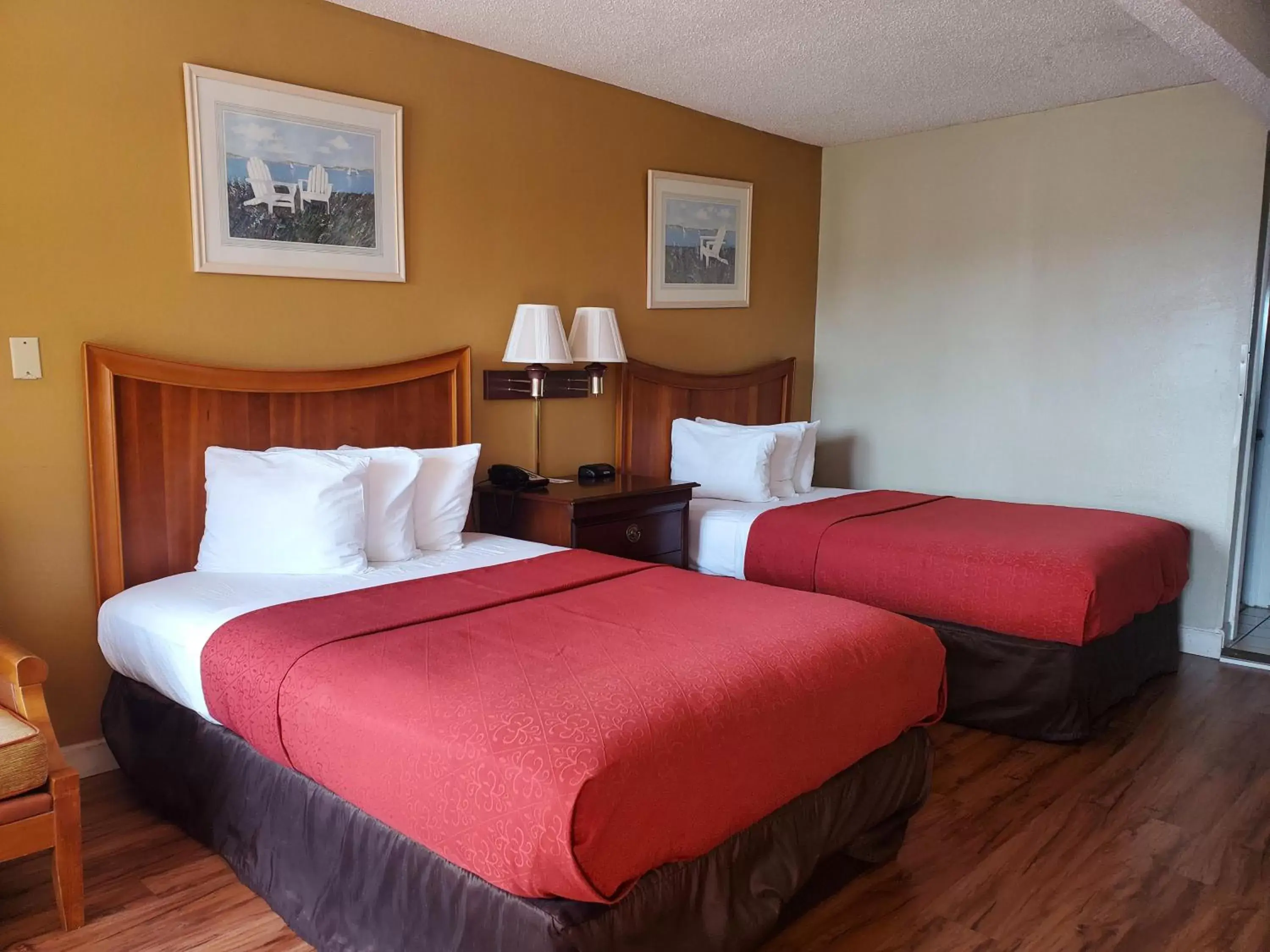 Bed in Atlantic Shores Inn and Suites