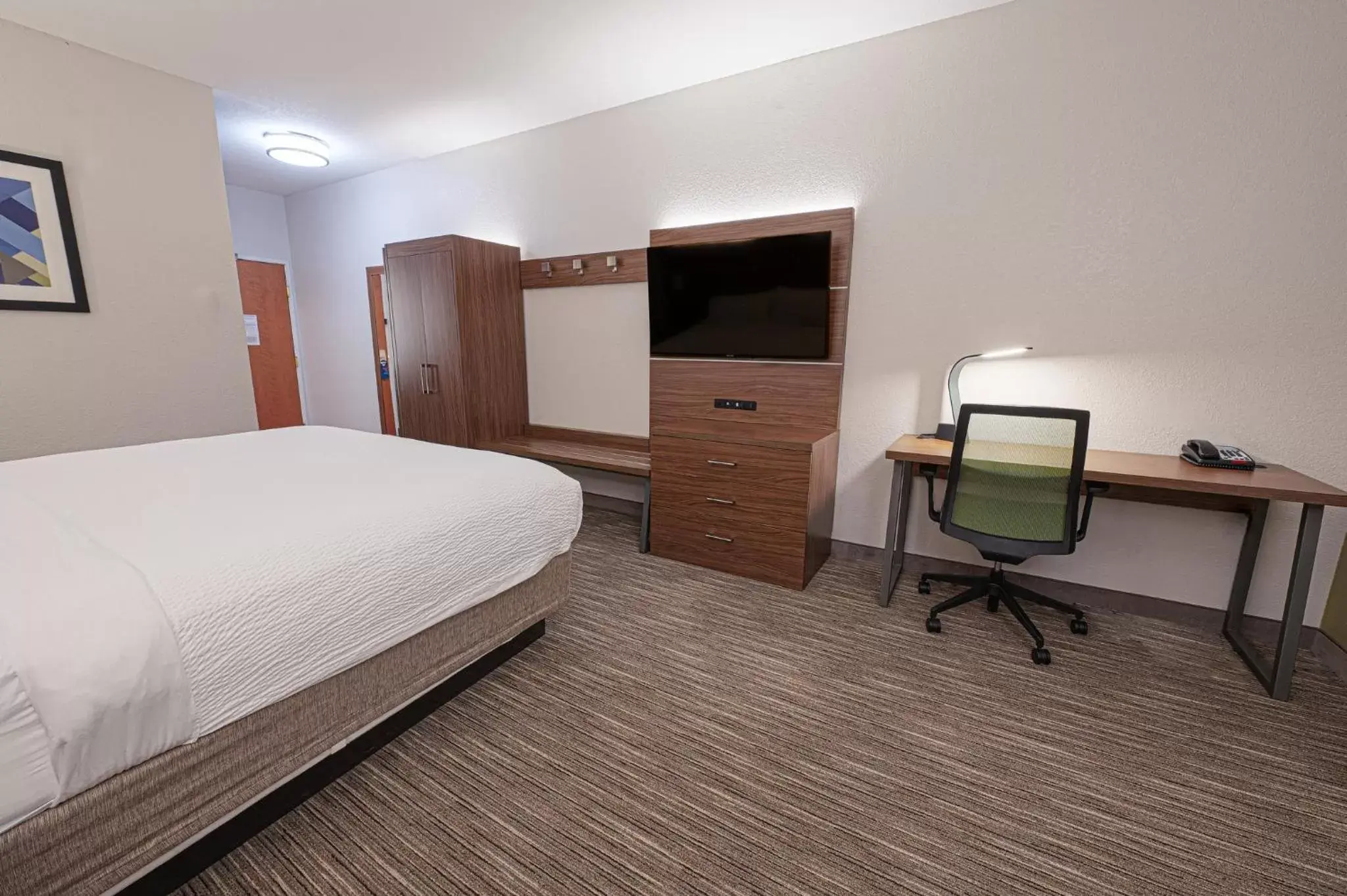 Photo of the whole room, TV/Entertainment Center in Holiday Inn Express Hotel & Suites East Lansing, an IHG Hotel