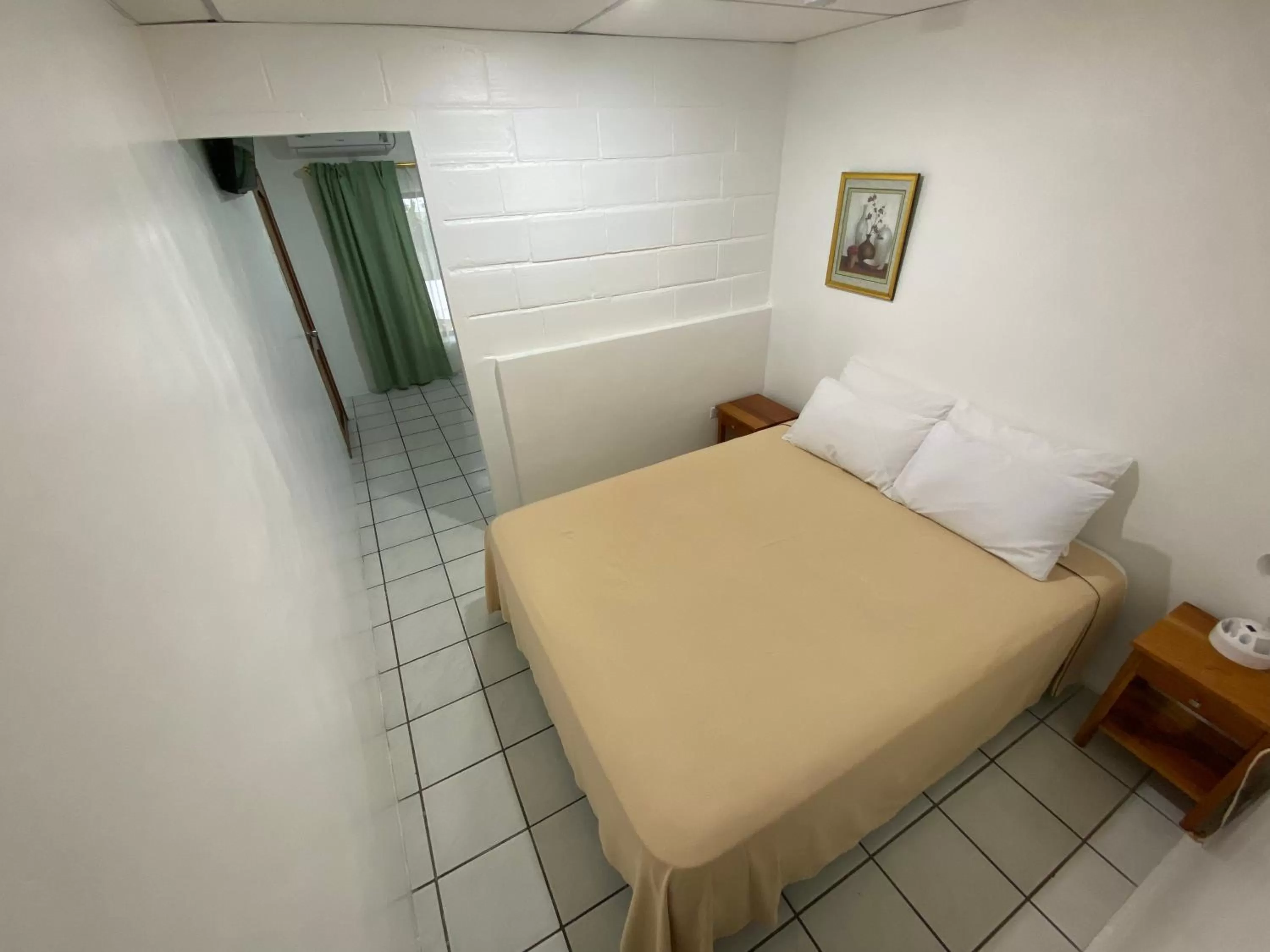 Bed in La Peregrina Galapagos B&B