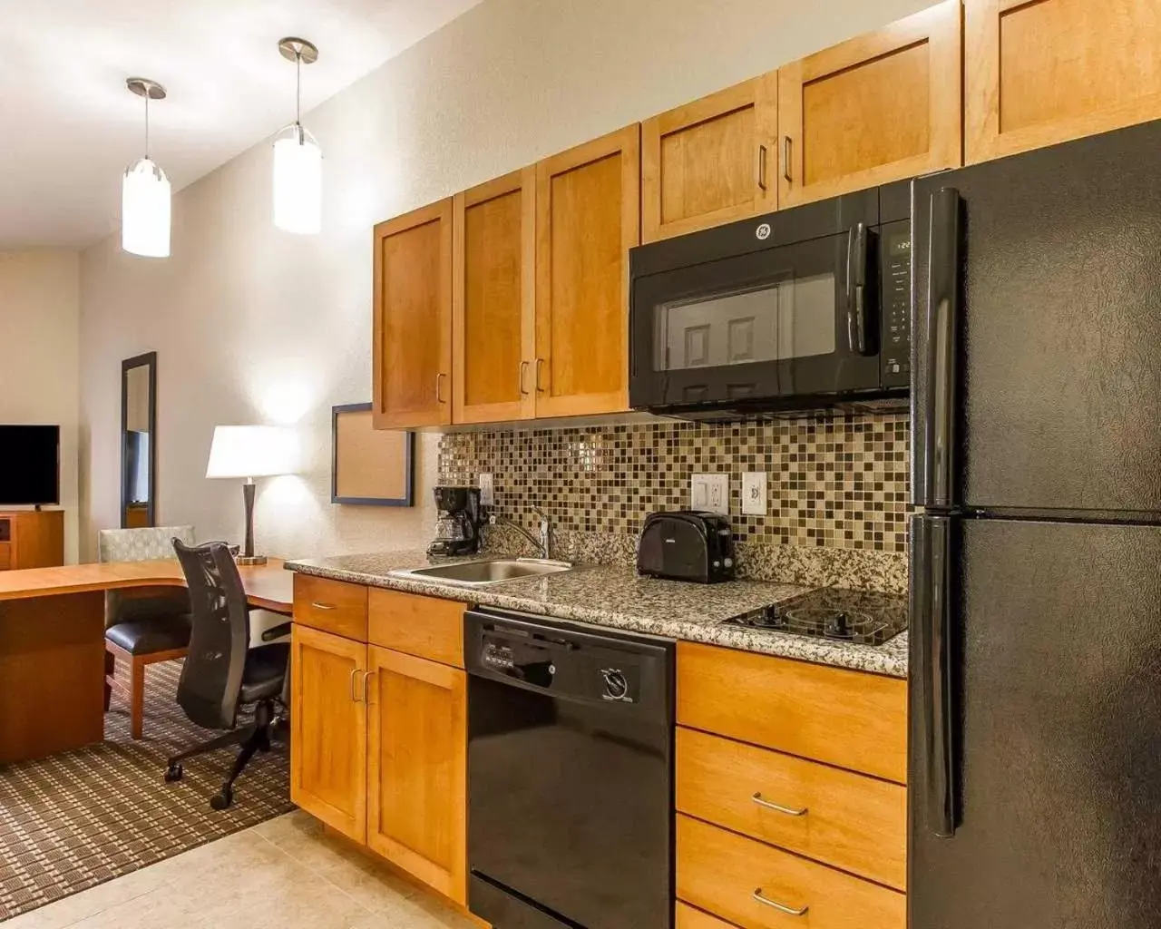 Kitchen/Kitchenette in Hawthorn Suites by Wyndham Minot